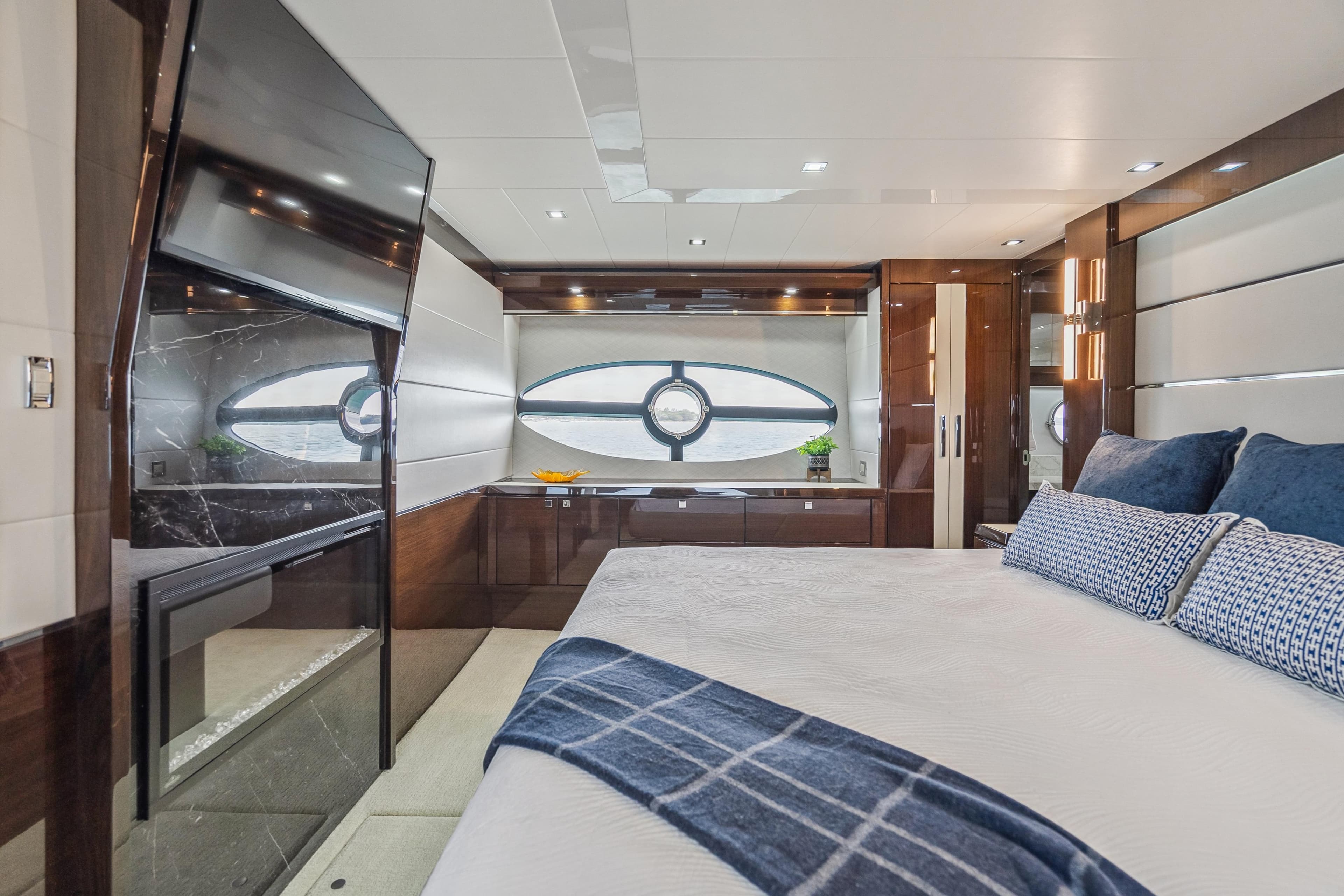 Luxurious bedroom interior of 2026 Neptunus 750SL yacht with modern design and elegant furnishings.