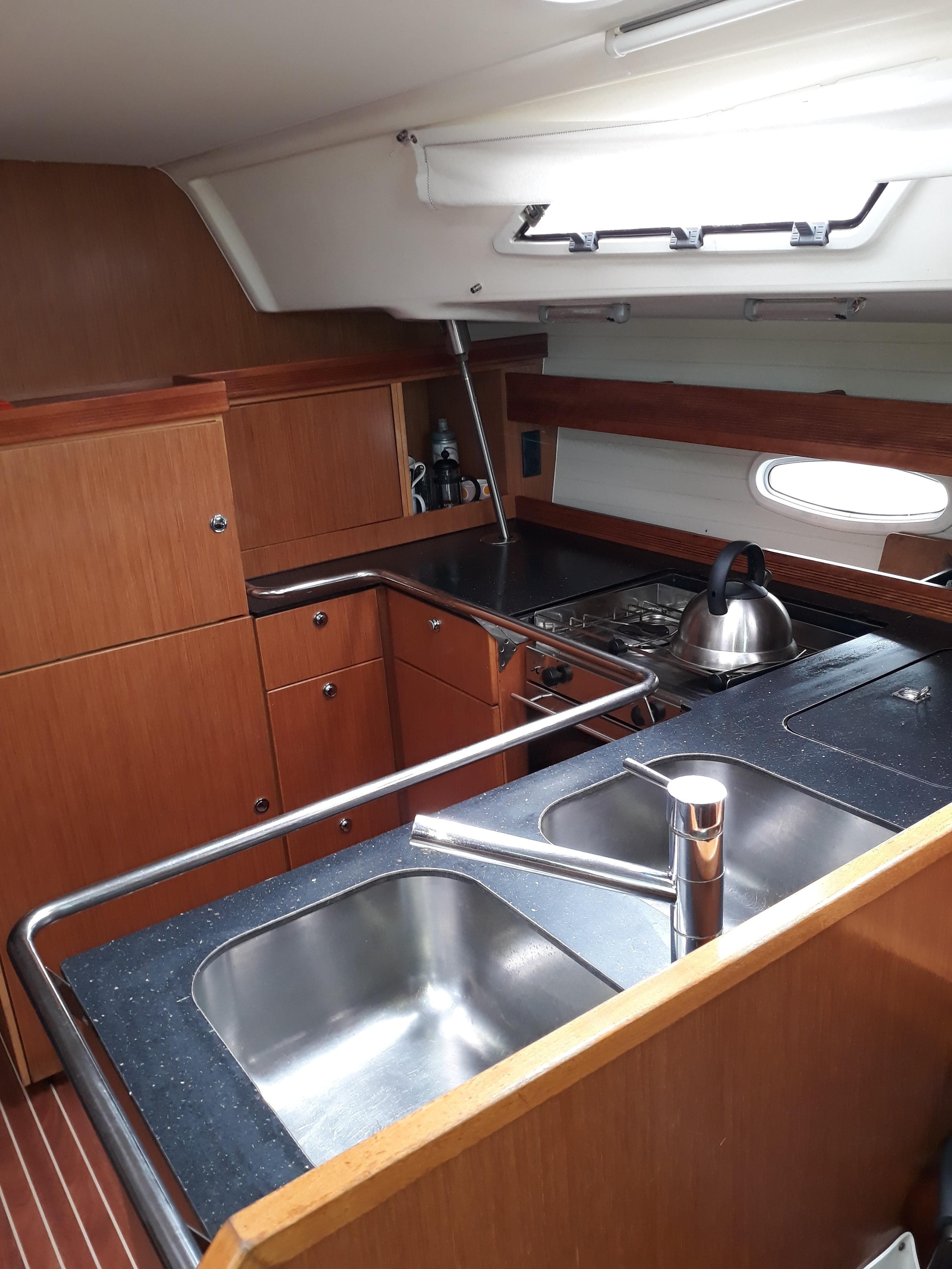 2010 Bavaria Cruiser 51 yacht kitchen with modern amenities and sleek design.