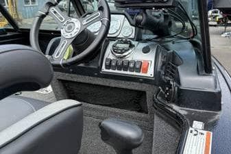 2020 Lund 1875 Pro-V Sport boat dashboard with steering wheel and control panel.