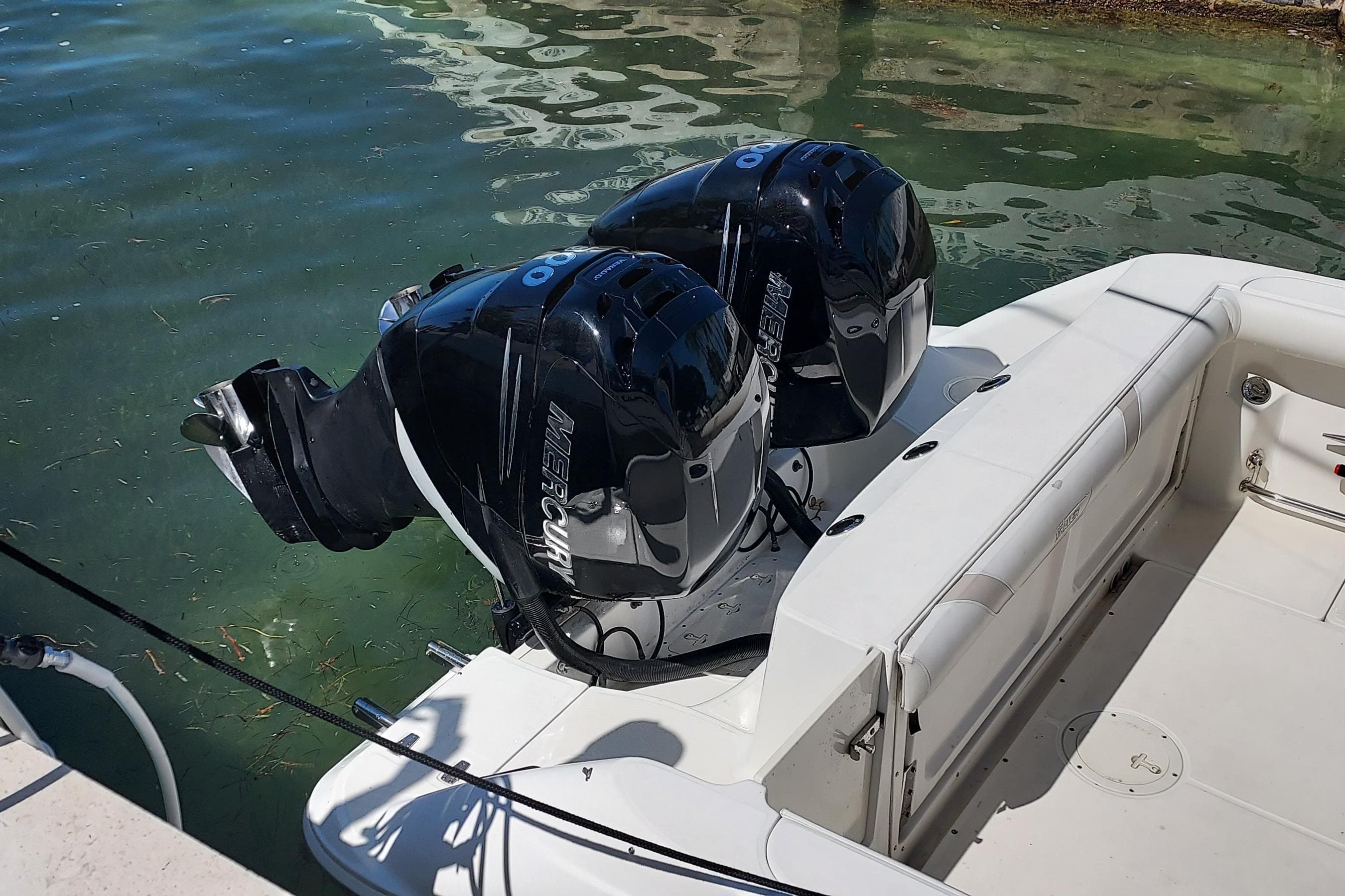 2009 Boston Whaler 320 Outrage Cuddy Cabin with dual Mercury outboard engines.
