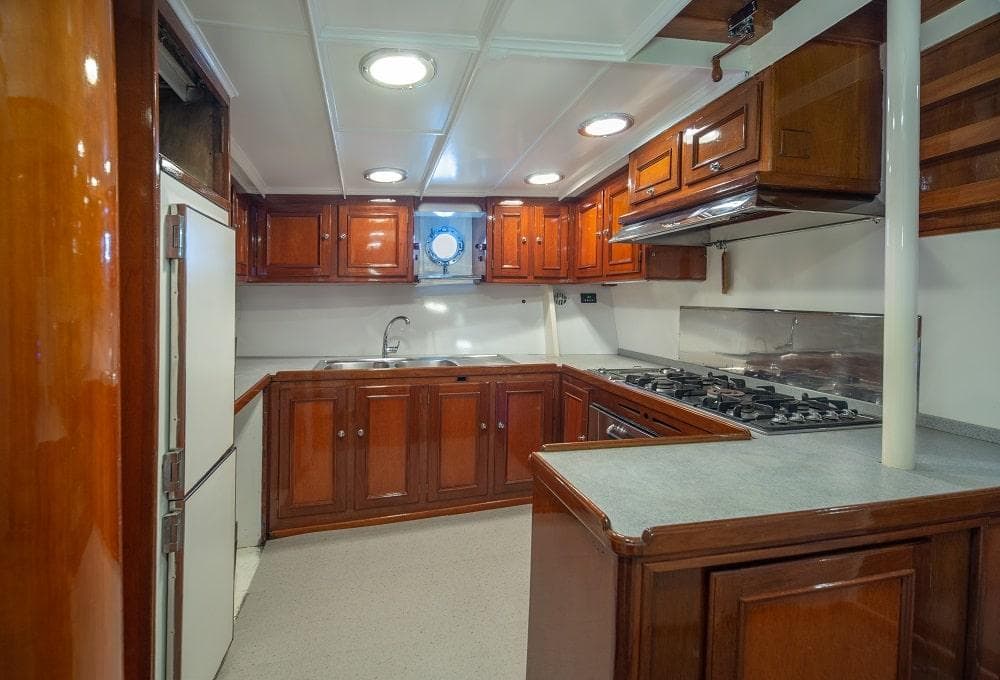 Luxurious wooden kitchen interior on a 1929 Camper & Nicholsons J Class yacht.