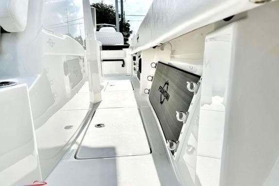 2023 Fountain 38 Tournament Edition boat interior, showcasing sleek white deck and storage compartments.