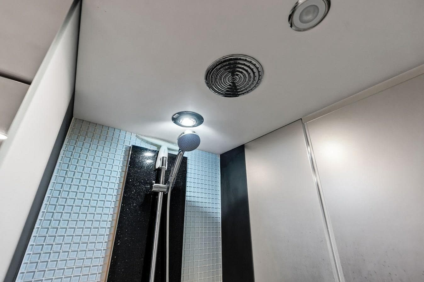 Modern shower area in 2013 Princess 78 yacht with sleek design and lighting.