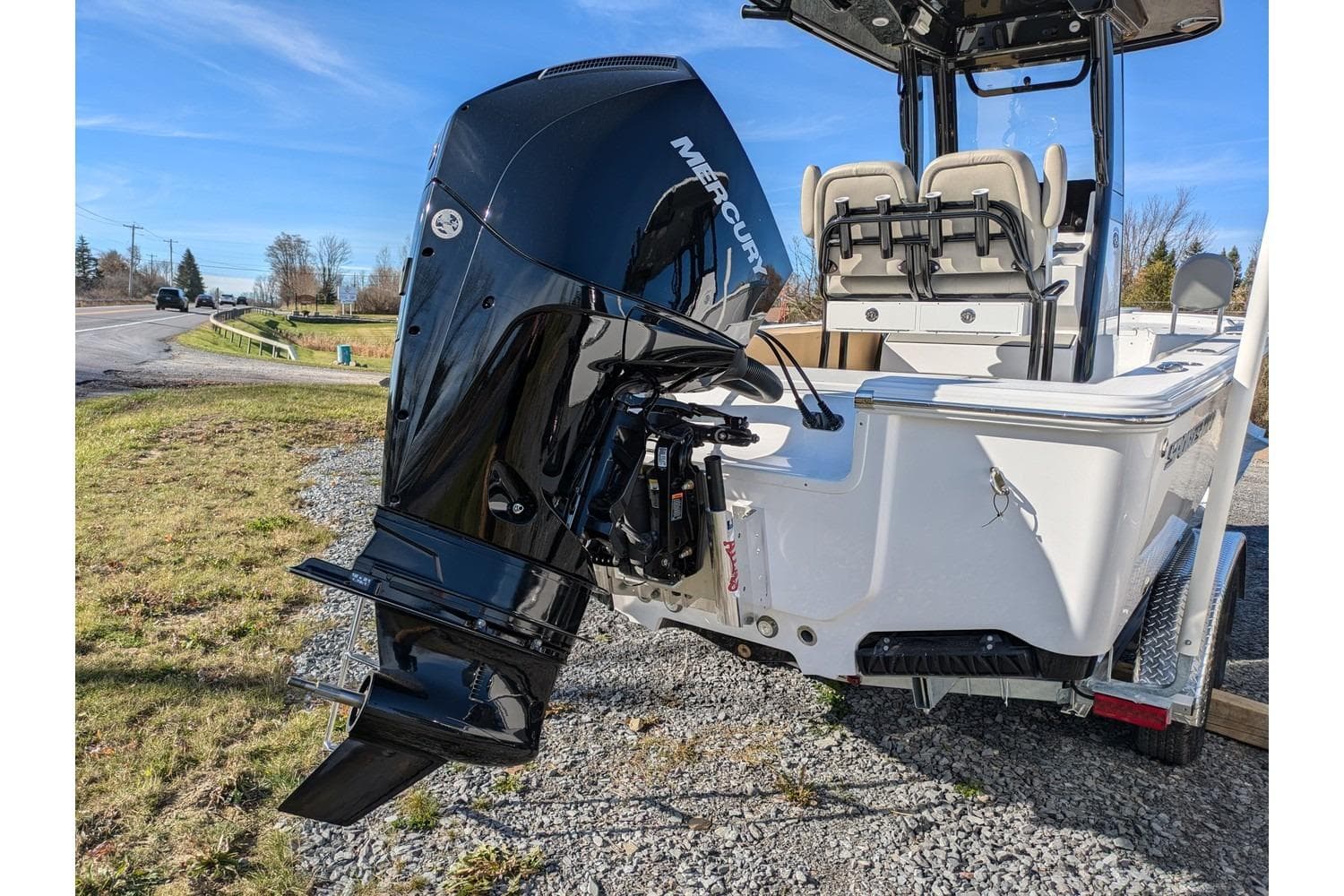 2025 Sportsman Masters 227 Bay Boat with Mercury outboard engine on a trailer.