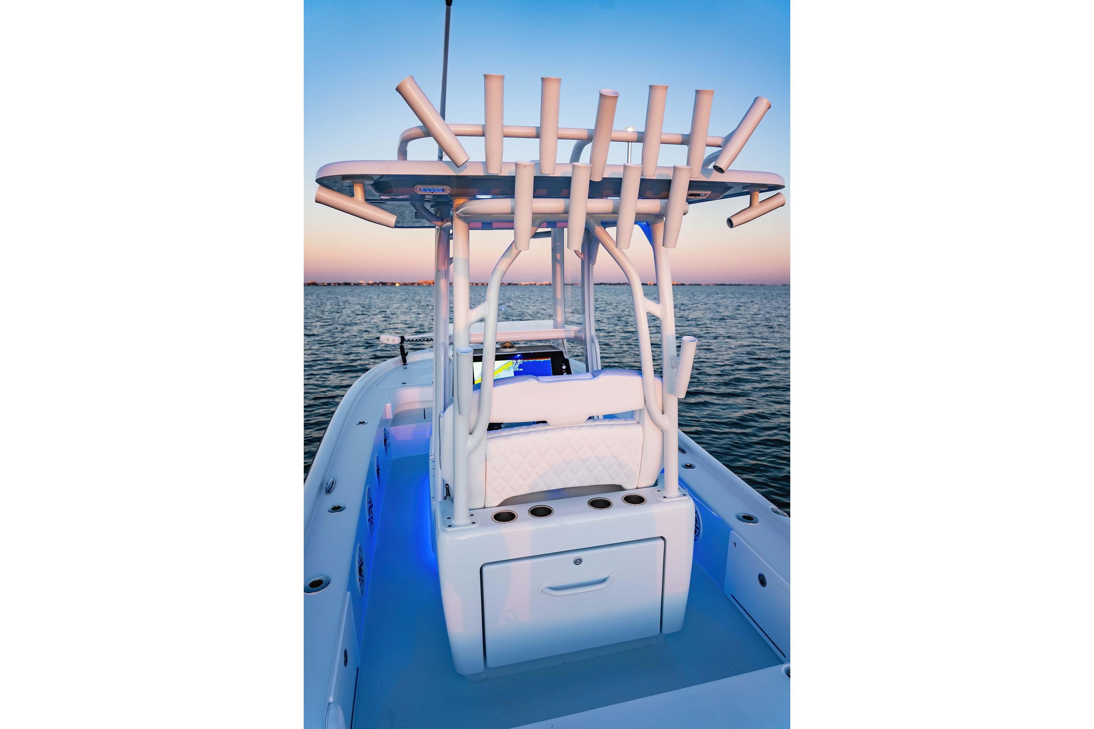 2026 Barker Boatworks 26 Calibogue Bay on water at sunset, featuring rod holders and seating.