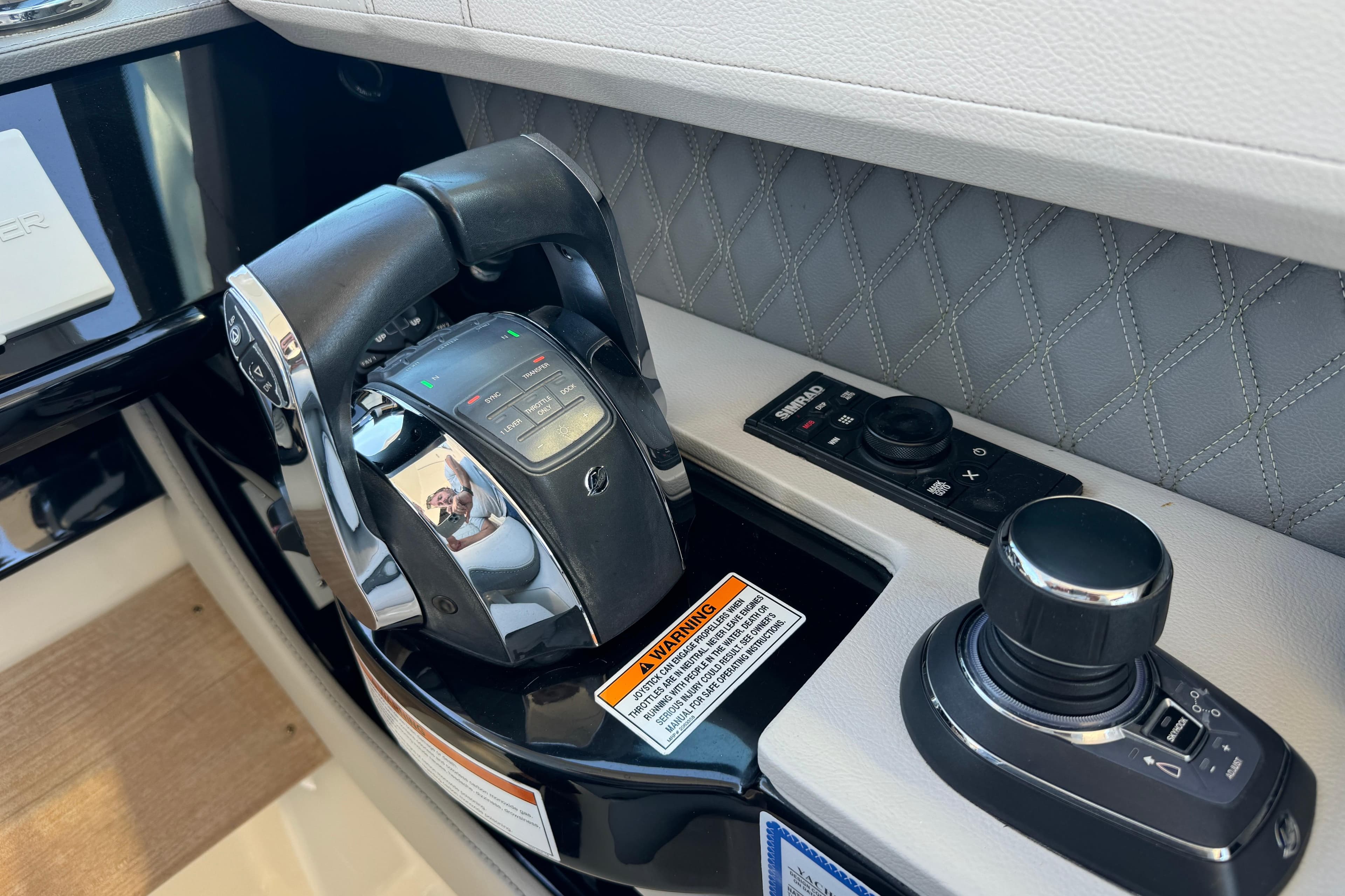 Control panel of 2022 Sea Ray SLX 400 Outboard with joystick and throttle.