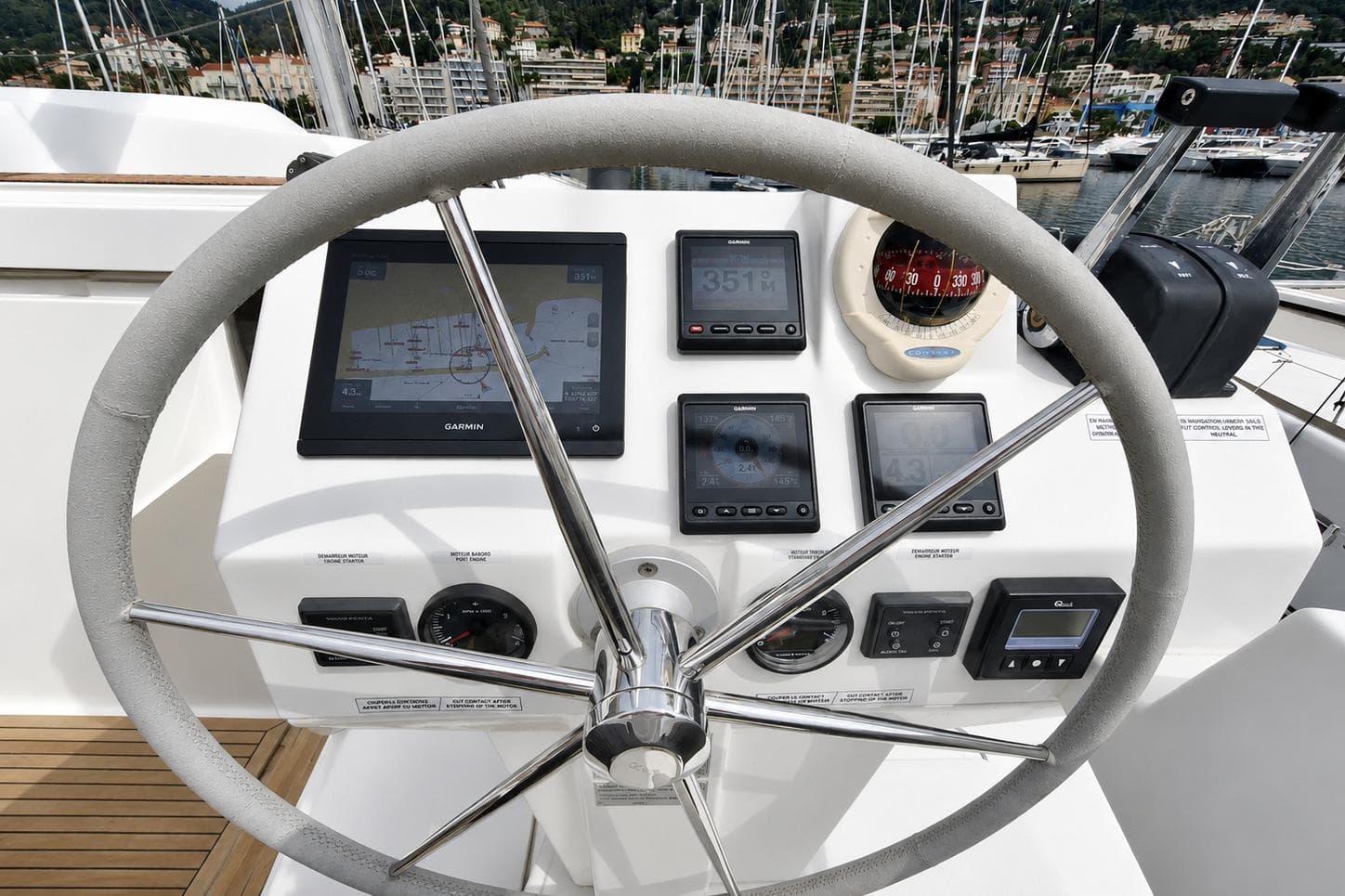 Steering wheel and navigation instruments on 2021 Fountaine Pajot Saona 47 yacht.