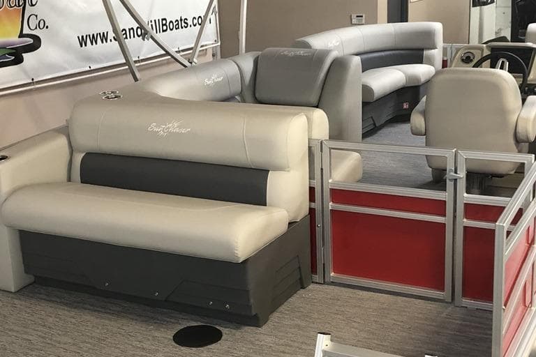 Luxurious interior of 2026 SunChaser Vista 20 CRB pontoon boat with plush seating.