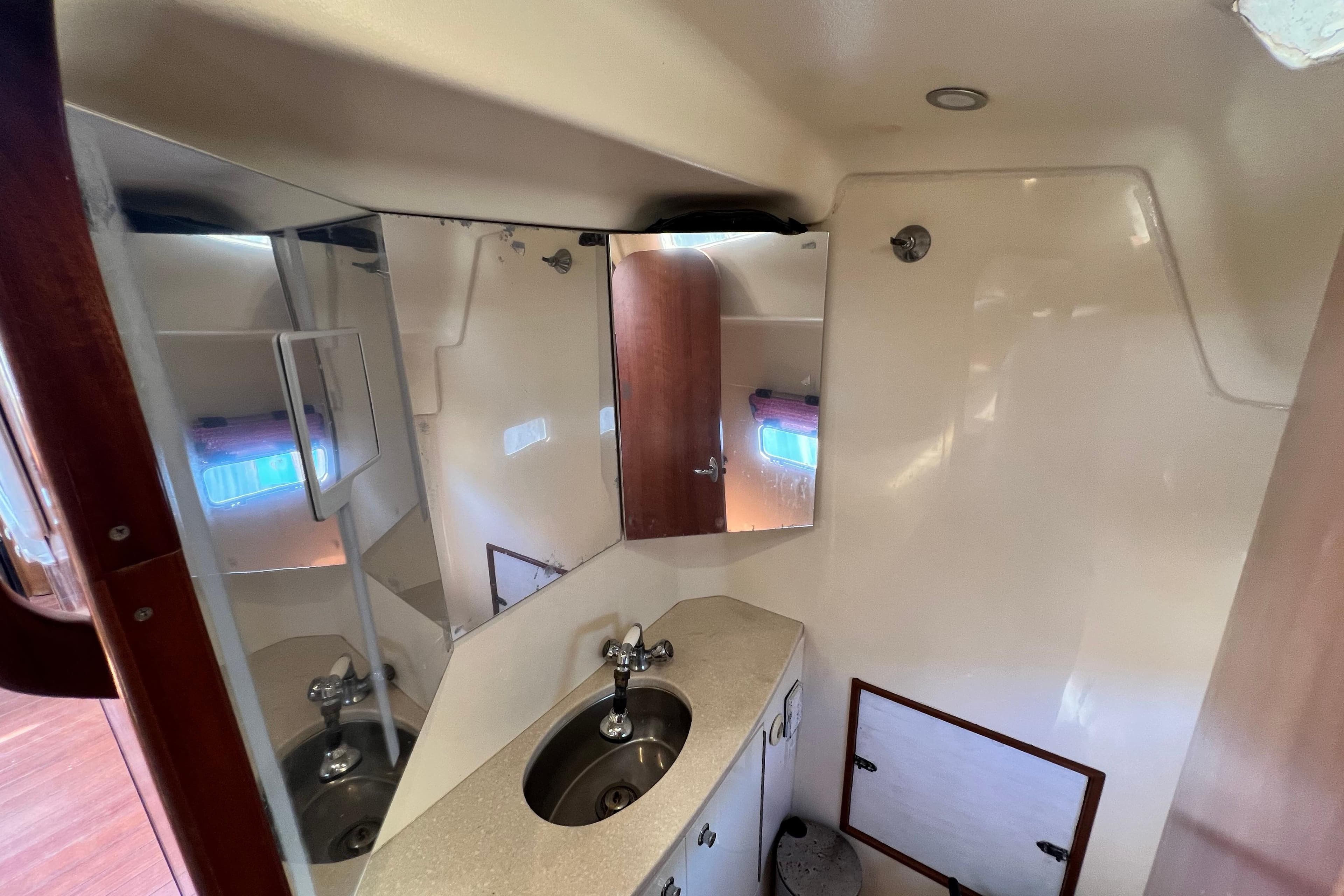 Bathroom interior of 2013 Gemini Legacy 35 yacht with sink and mirror.