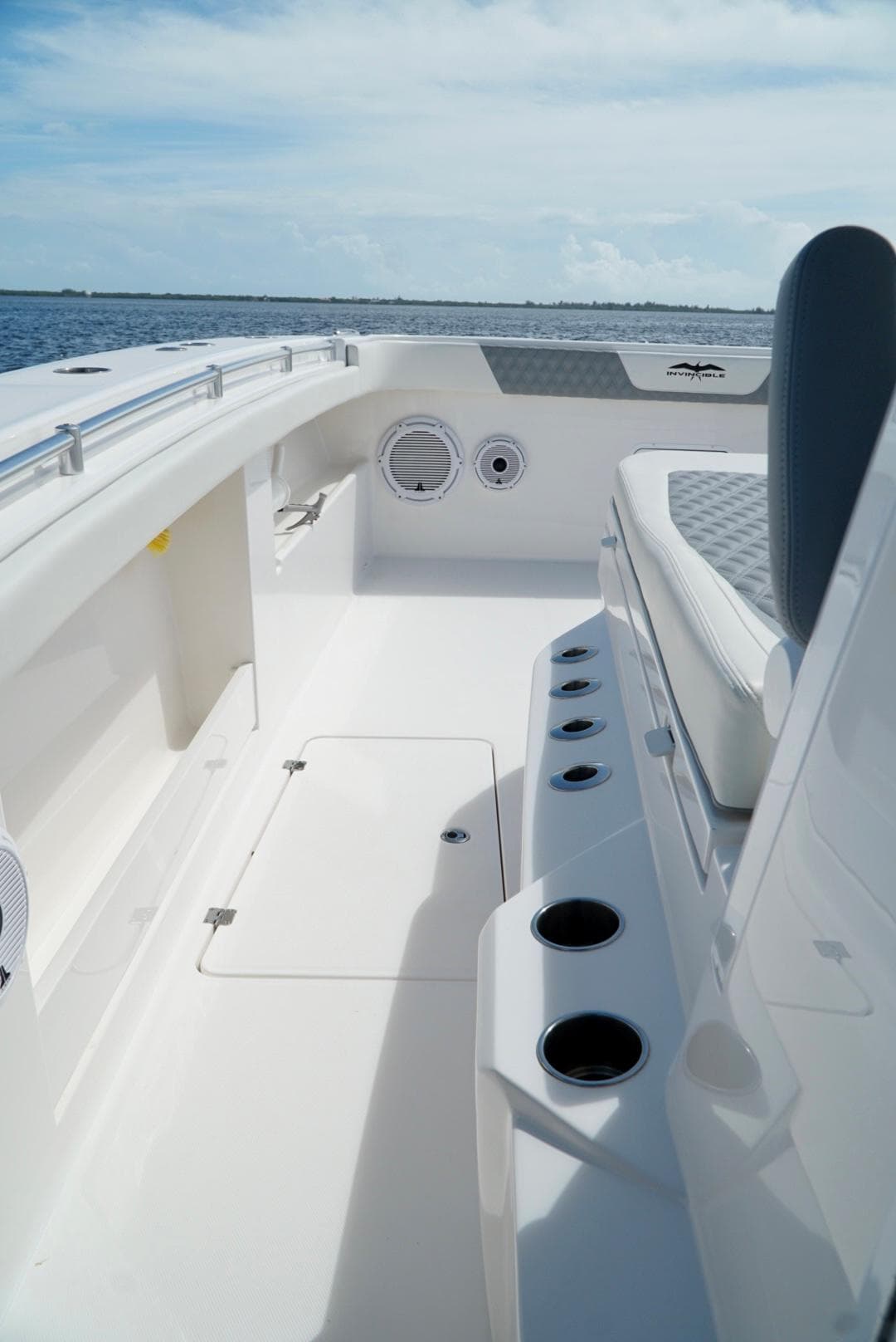 2021 Invincible 46 Catamaran deck with seating and cup holders.