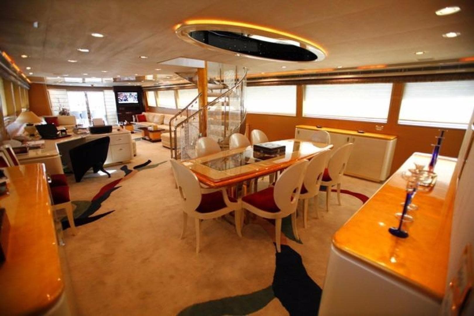 Luxurious interior of a 1998 Trident 127 yacht with elegant dining area and modern decor.