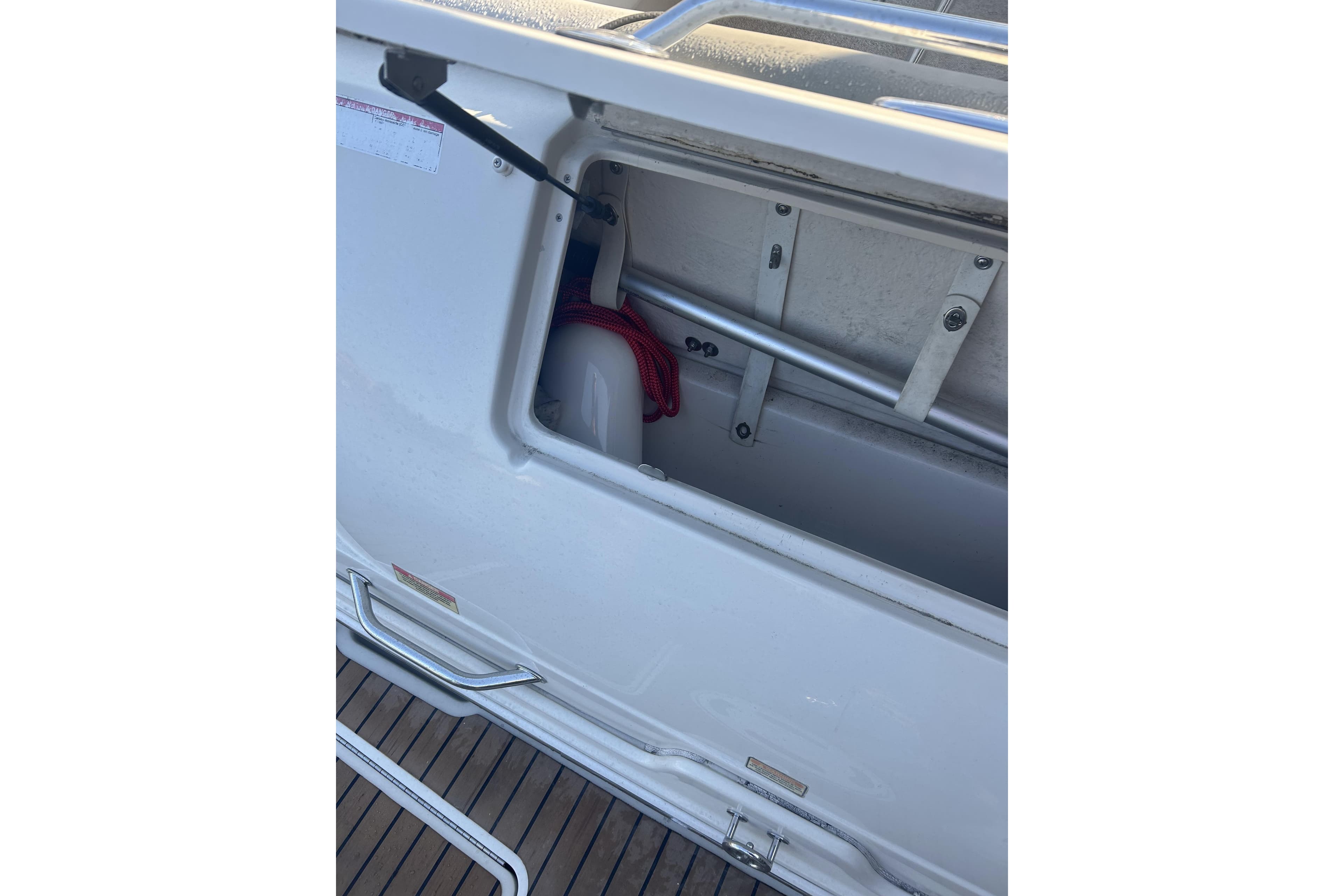 Storage compartment on a 2007 Sea Ray 250 Amberjack boat.