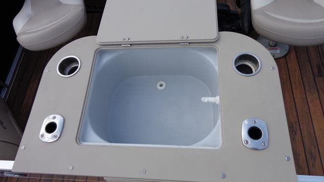 2014 Avalon Wind Jammer boat livewell with cup holders and seating.