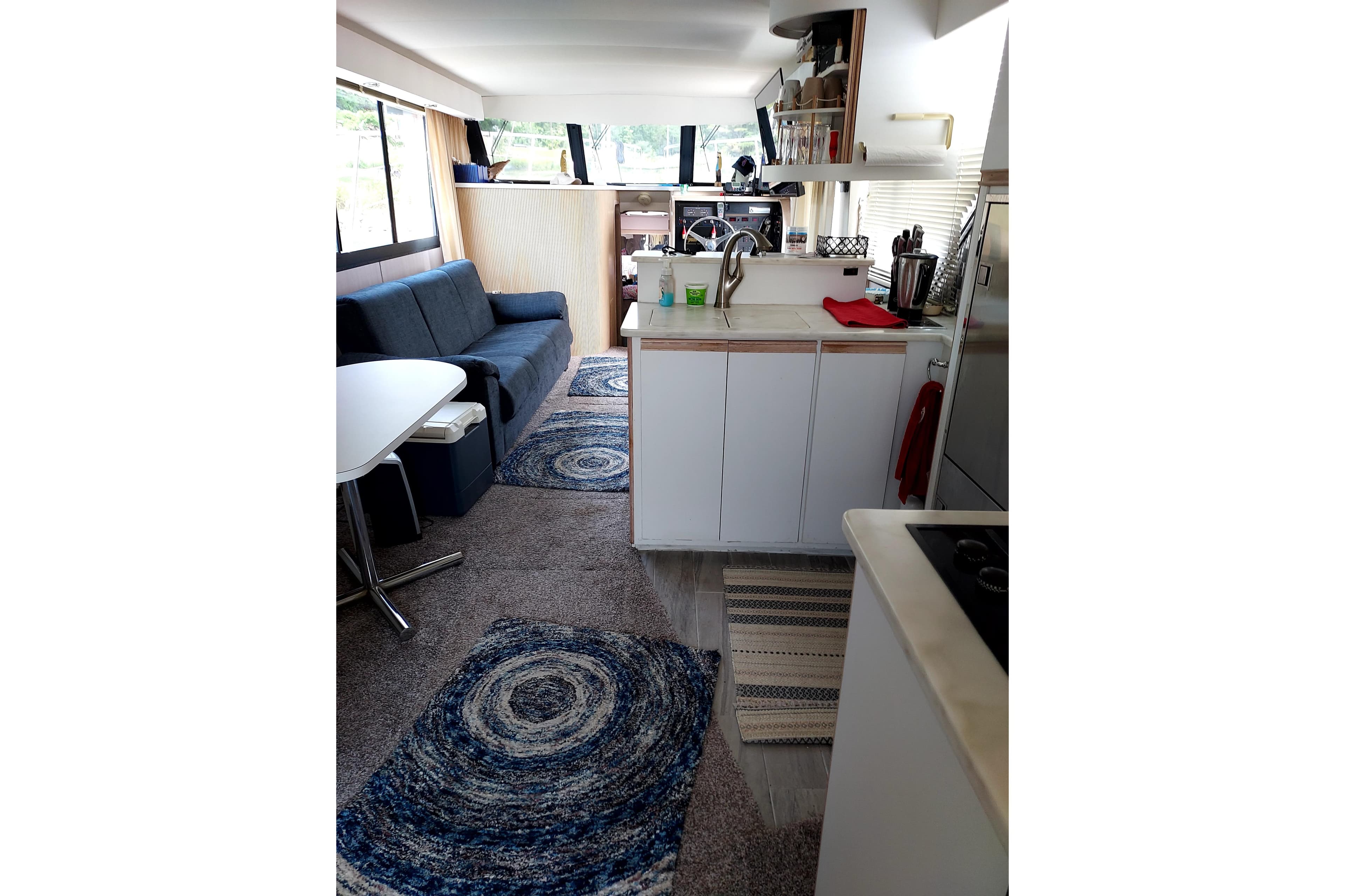 Interior of 1991 Bluewater Coastal Cruiser with modern kitchen and cozy seating area.