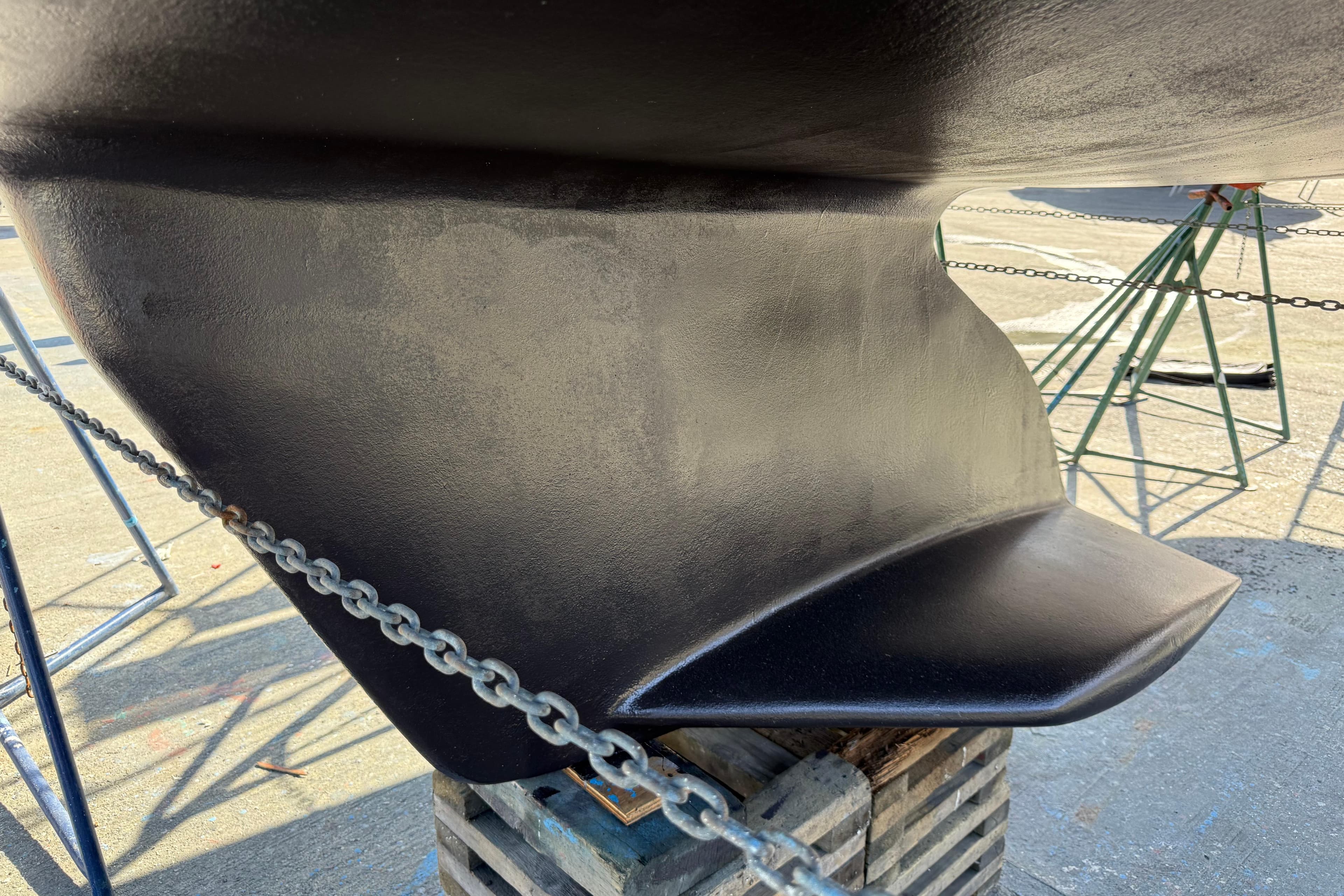 Close-up of a 2007 Catalina 320 MkII sailboat keel on a stand.