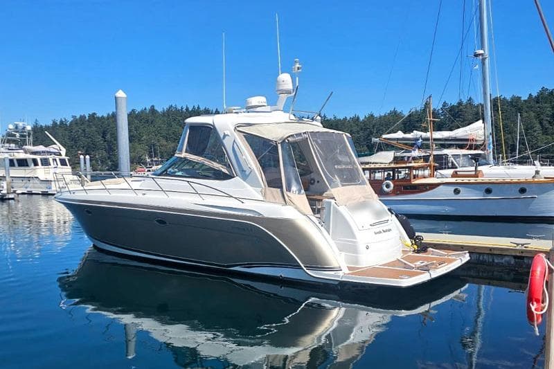 2008 Formula 40 Performance Cruiser docked in a marina under clear blue skies.