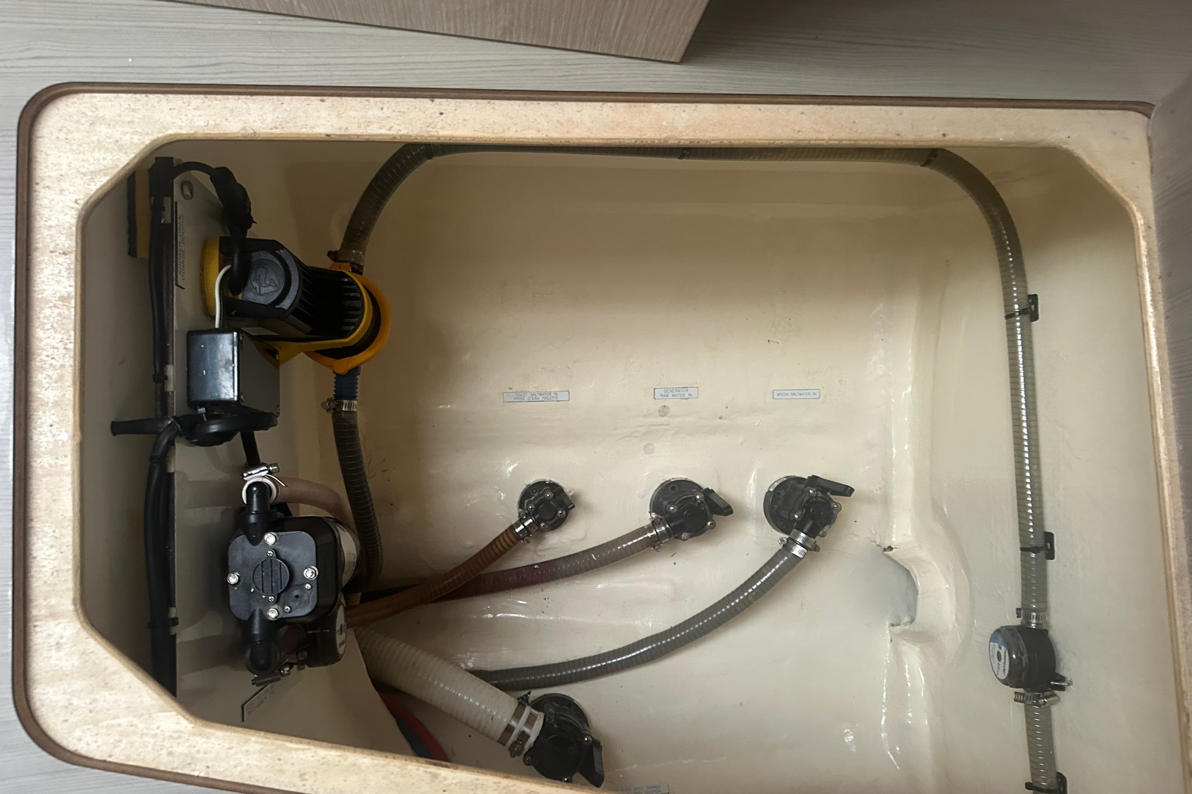 Engine compartment of a 2018 Leopard 45 yacht, showing hoses and mechanical components.