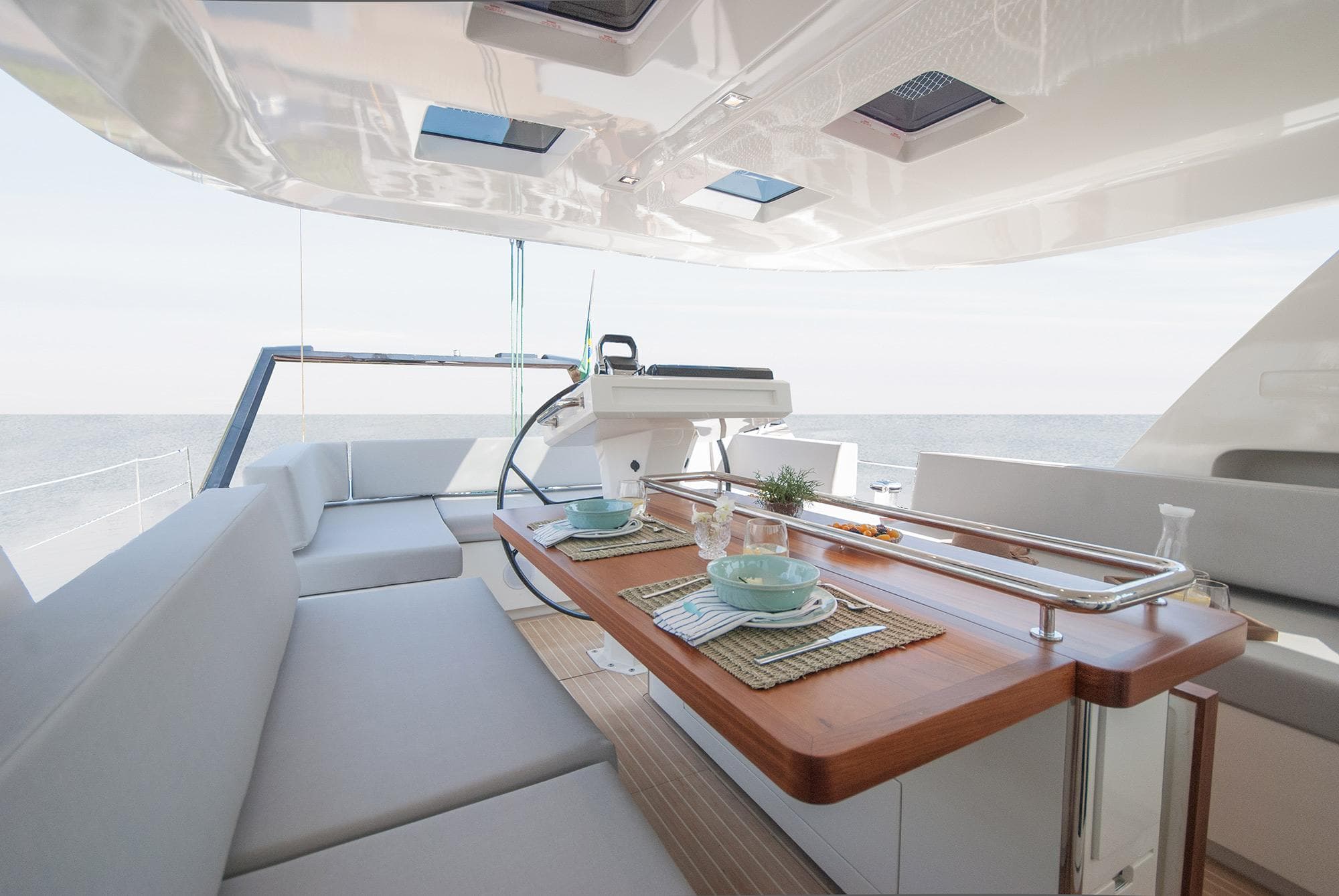 Luxurious interior of 2025 MCP Global Exp 68 yacht with elegant dining setup.