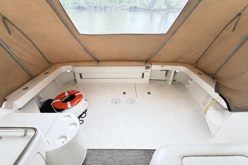 1998 Sea Ray 370 Express Cruiser interior with canopy and life preserver.