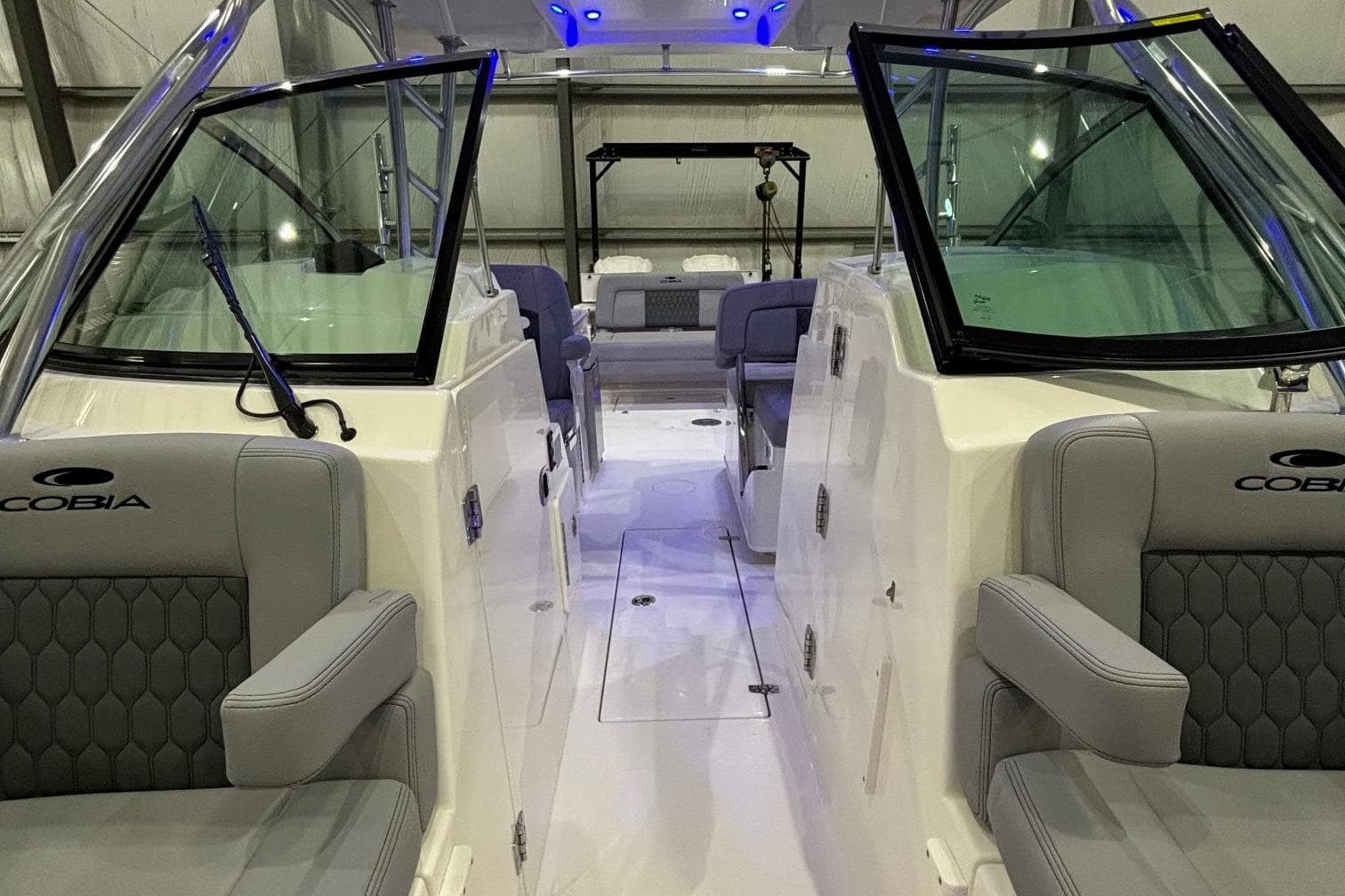 2025 Cobia 280 Dual Console boat interior with gray seating and modern design.