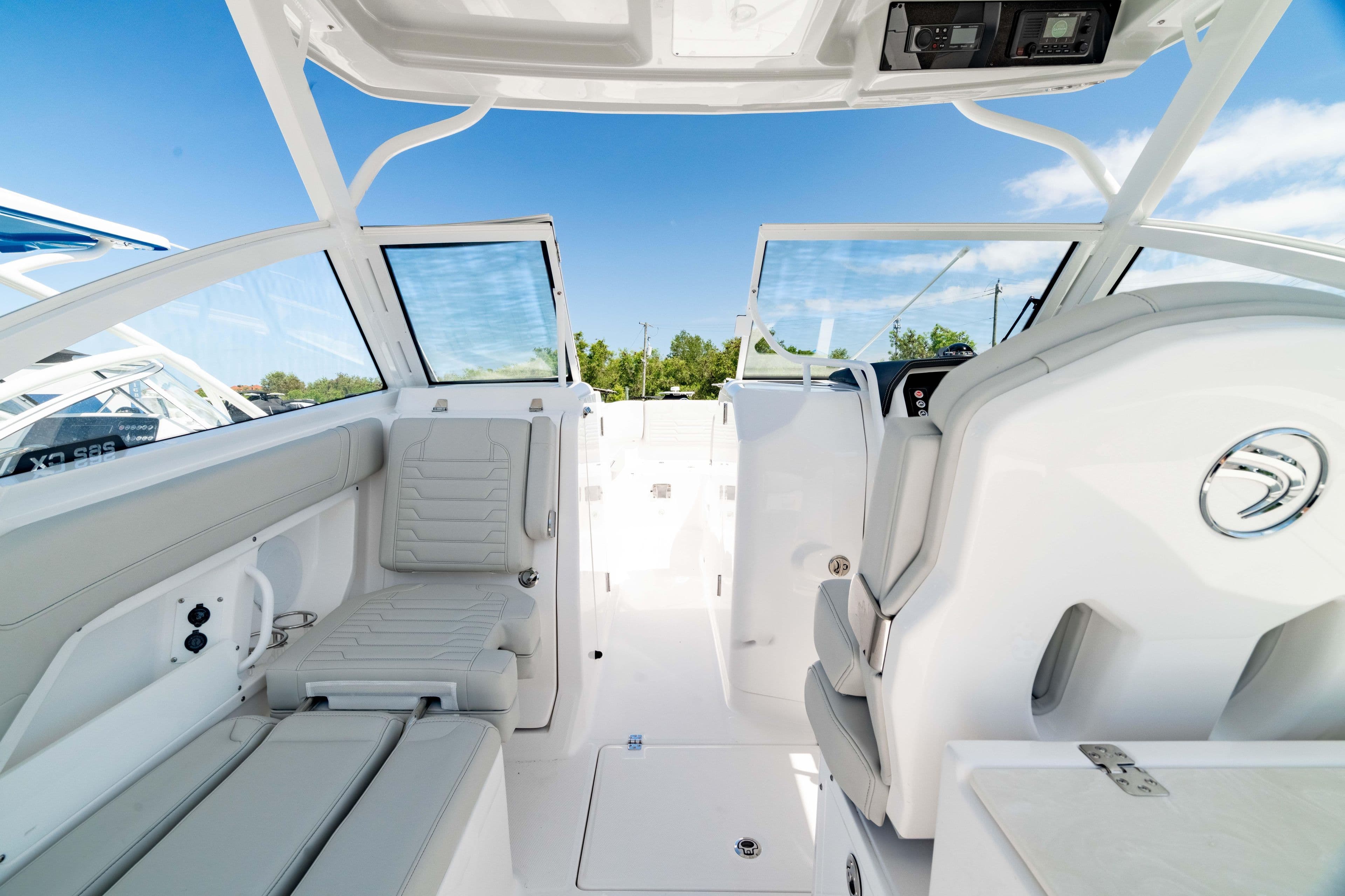 Interior view of 2026 Edgewater 262CX Crossover boat, featuring sleek seating and modern design.