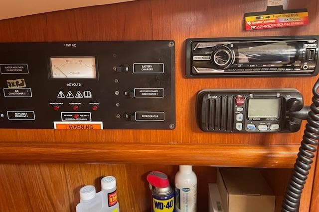 Control panel and radio equipment on 2002 Jeanneau Sun Odyssey 45.2 yacht.