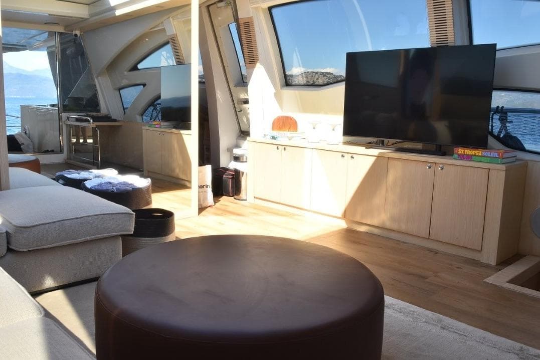 Luxurious interior of 2007 Azimut 86S yacht with modern furnishings and large windows.