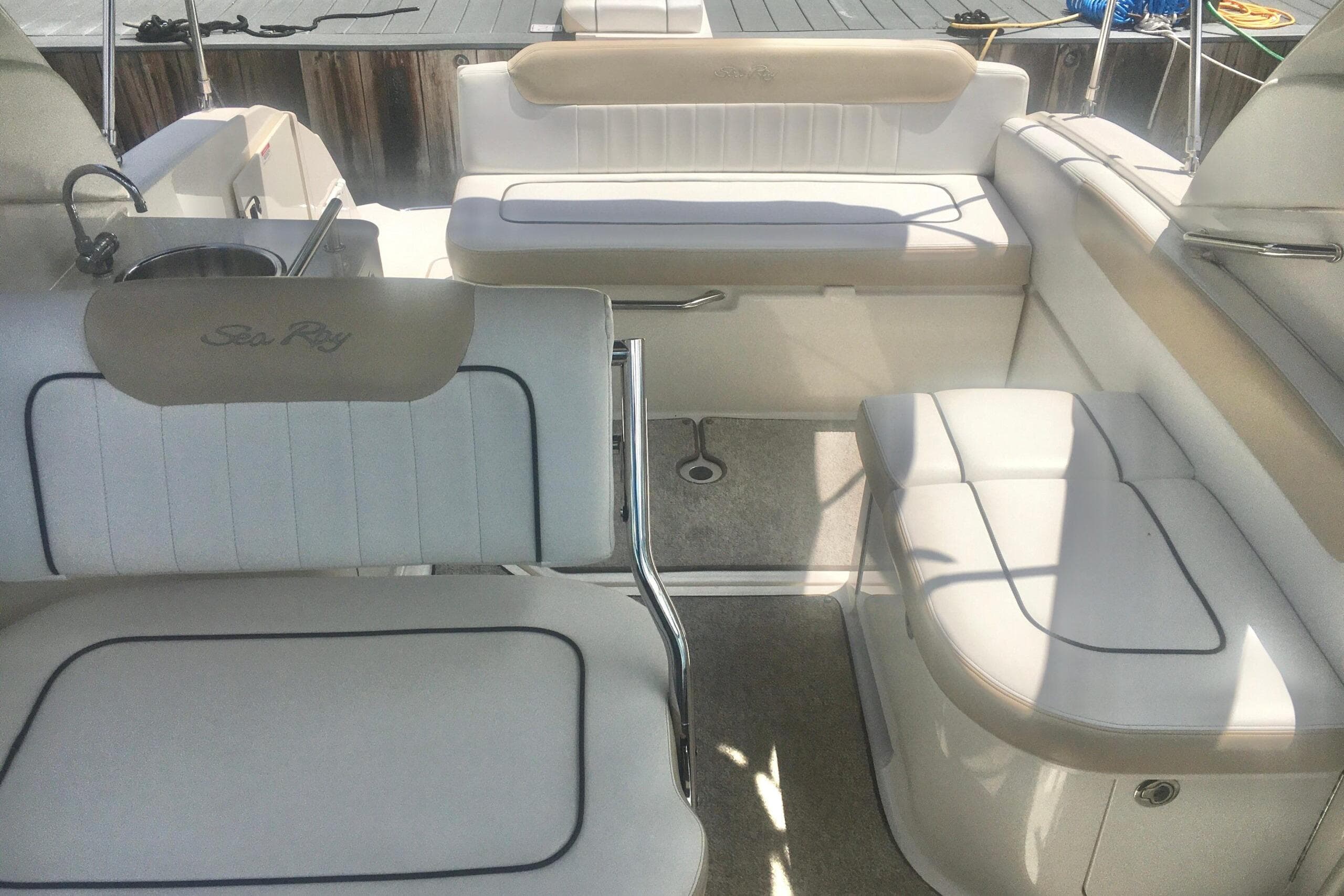 2010 Sea Ray 260 Sundancer boat interior with white seating and sleek design.