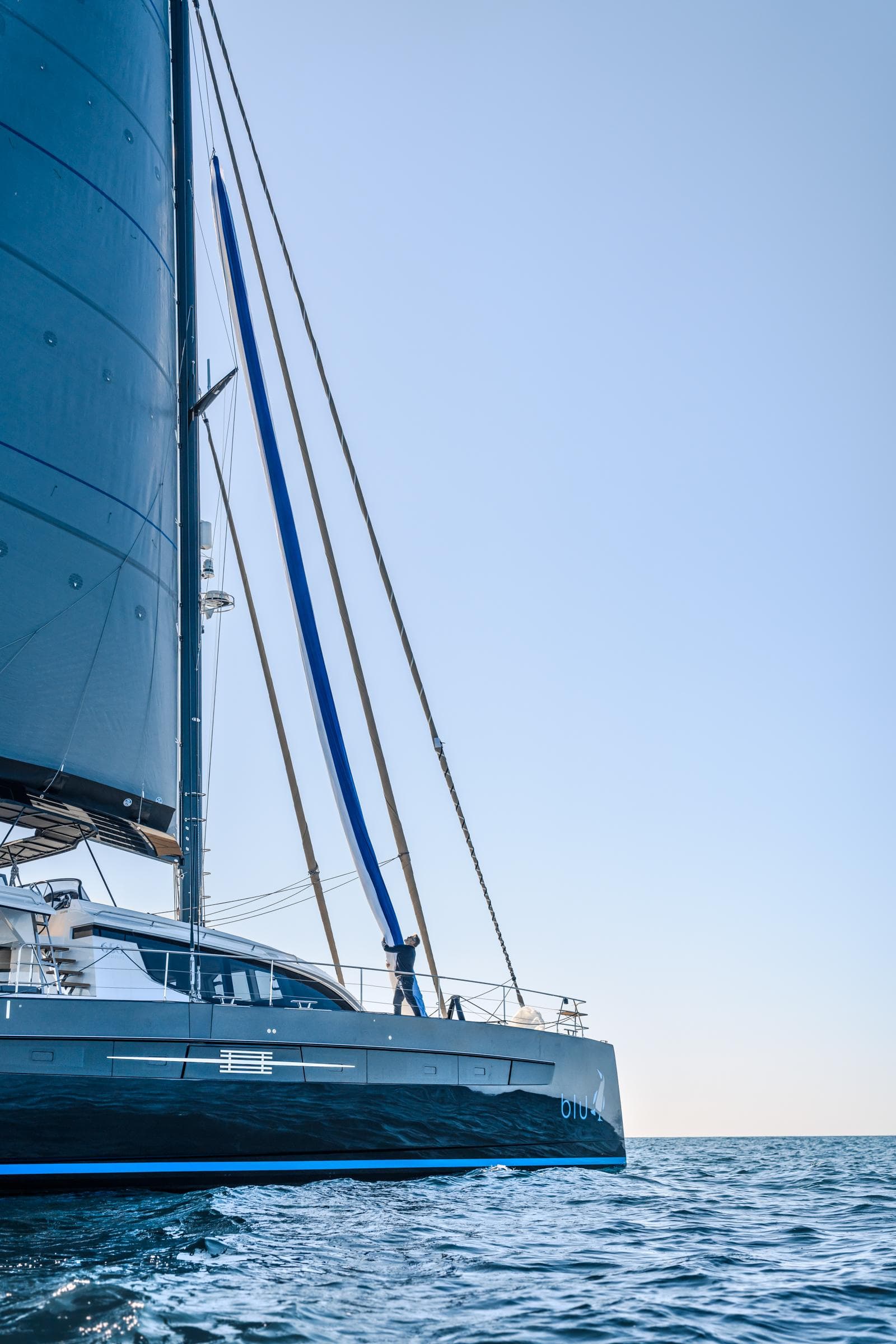 Luxury Privilege Signature 650 catamaran sailing on open sea, 2025 model.