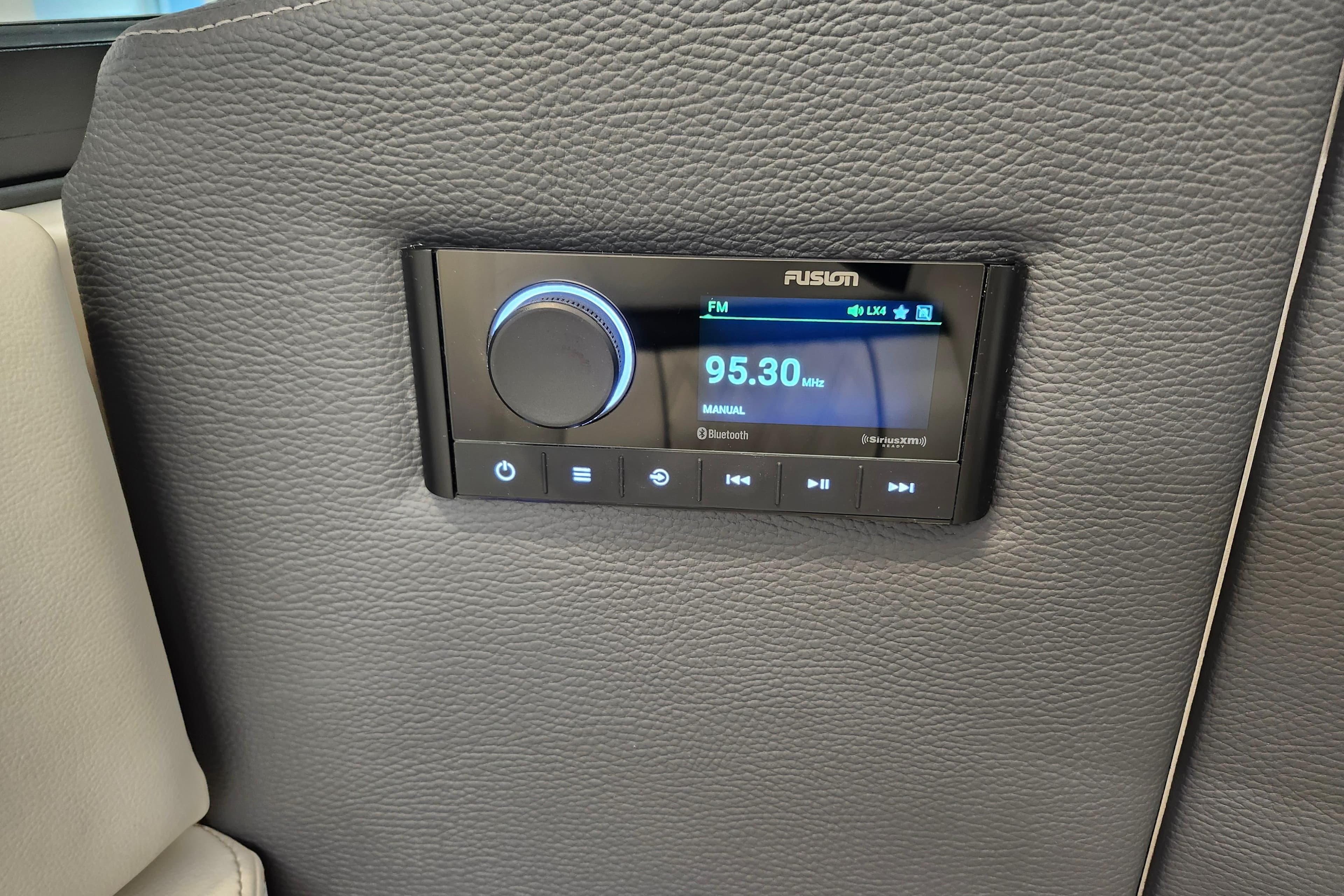 2025 Regal LX4 audio system with Fusion radio display, featuring FM and Bluetooth options.