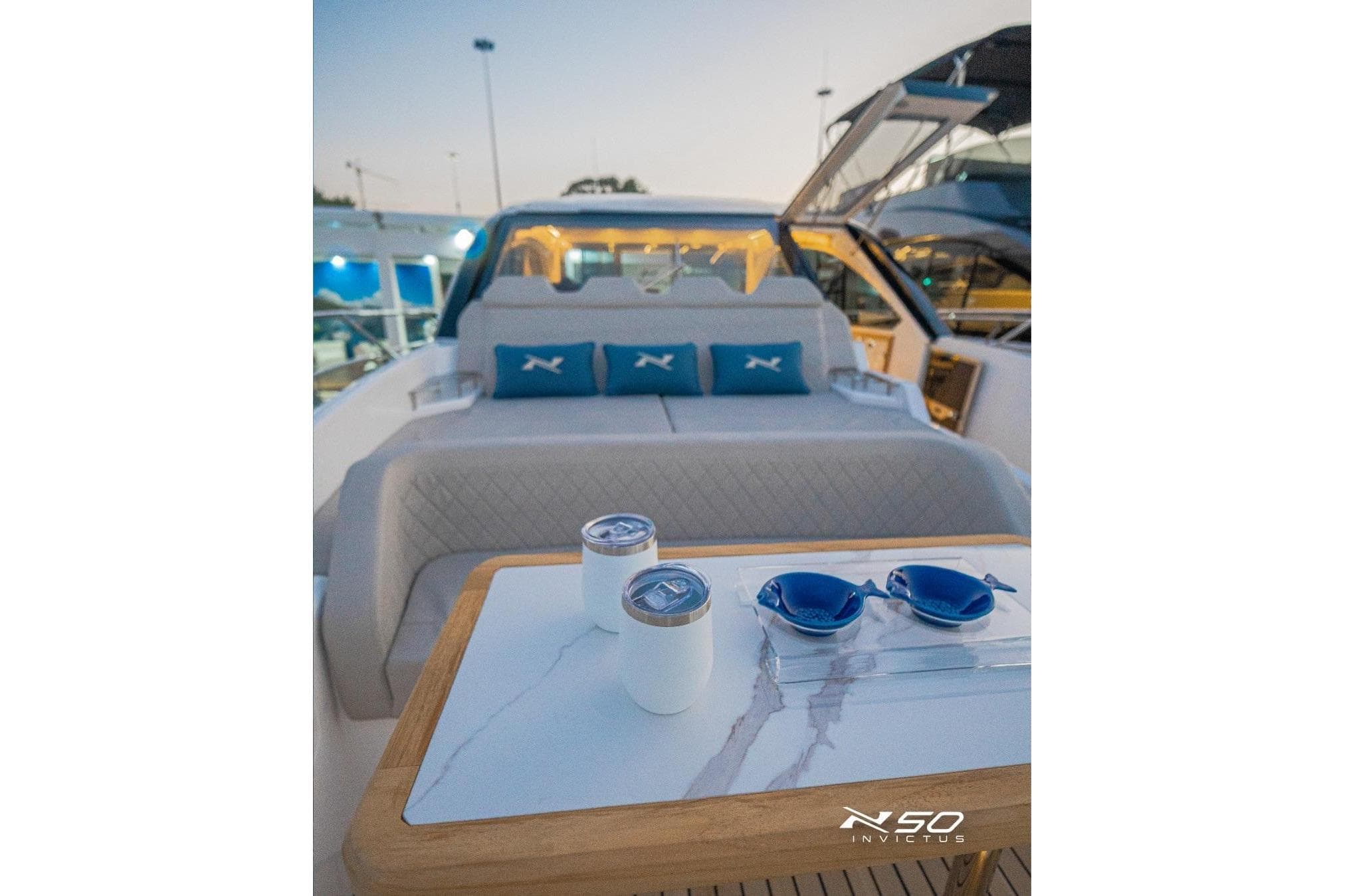 Luxurious 2025 NX Boats NX50 Invictus HT interior with elegant seating and stylish accessories.