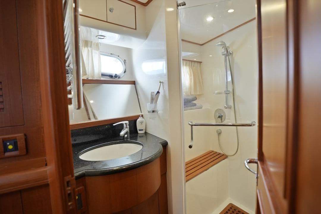 Luxurious bathroom in 2010 Selene 60 Ocean Trawler with modern shower and elegant sink.