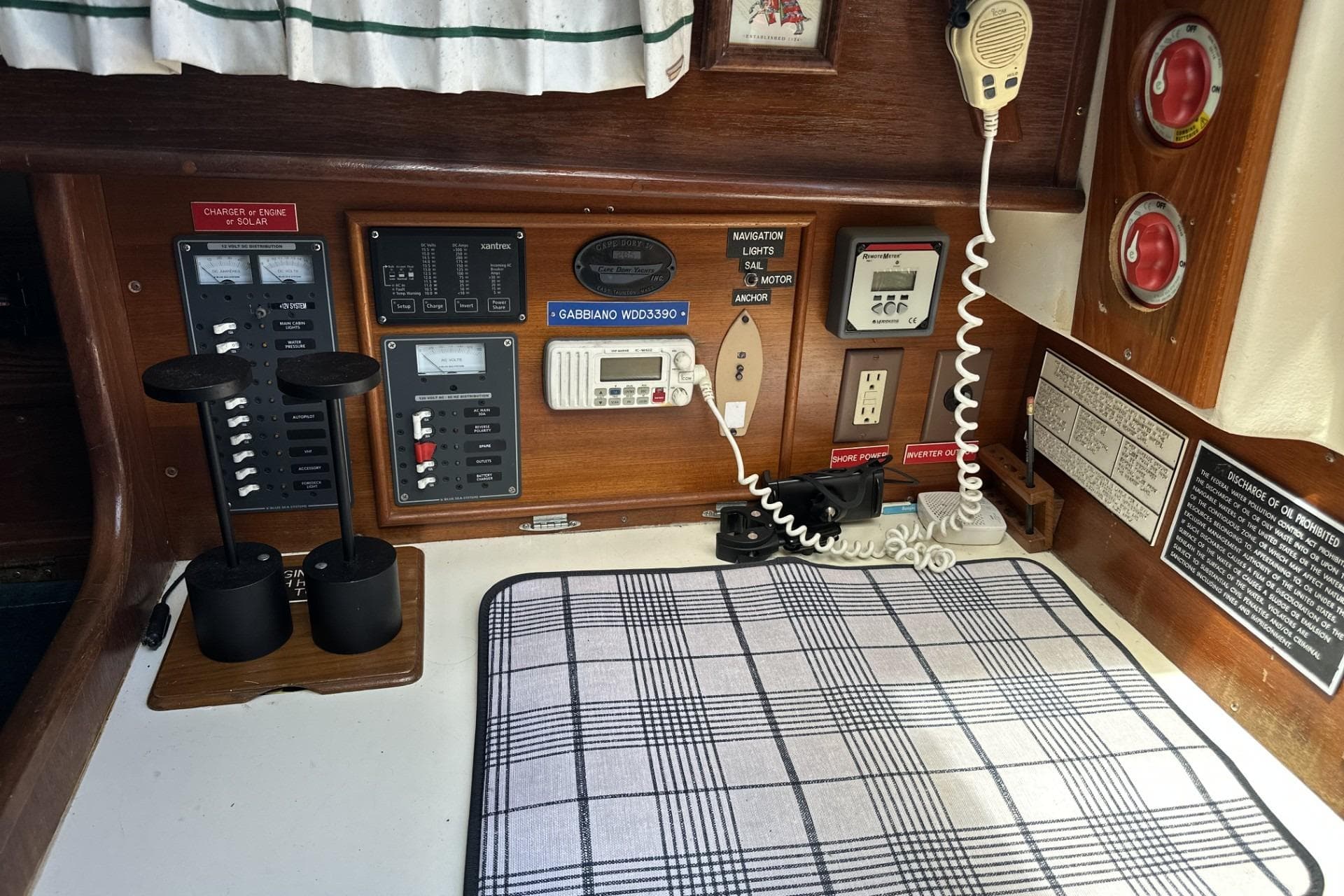 Control panel of a 1982 Cape Dory 30 sailboat with navigation and communication equipment.
