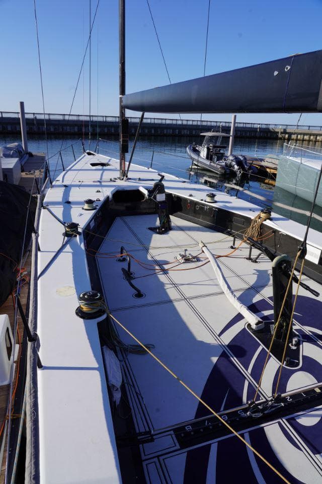 2015 Judel and Vrolijk TP 52 sailboat docked, showcasing sleek deck design and rigging.