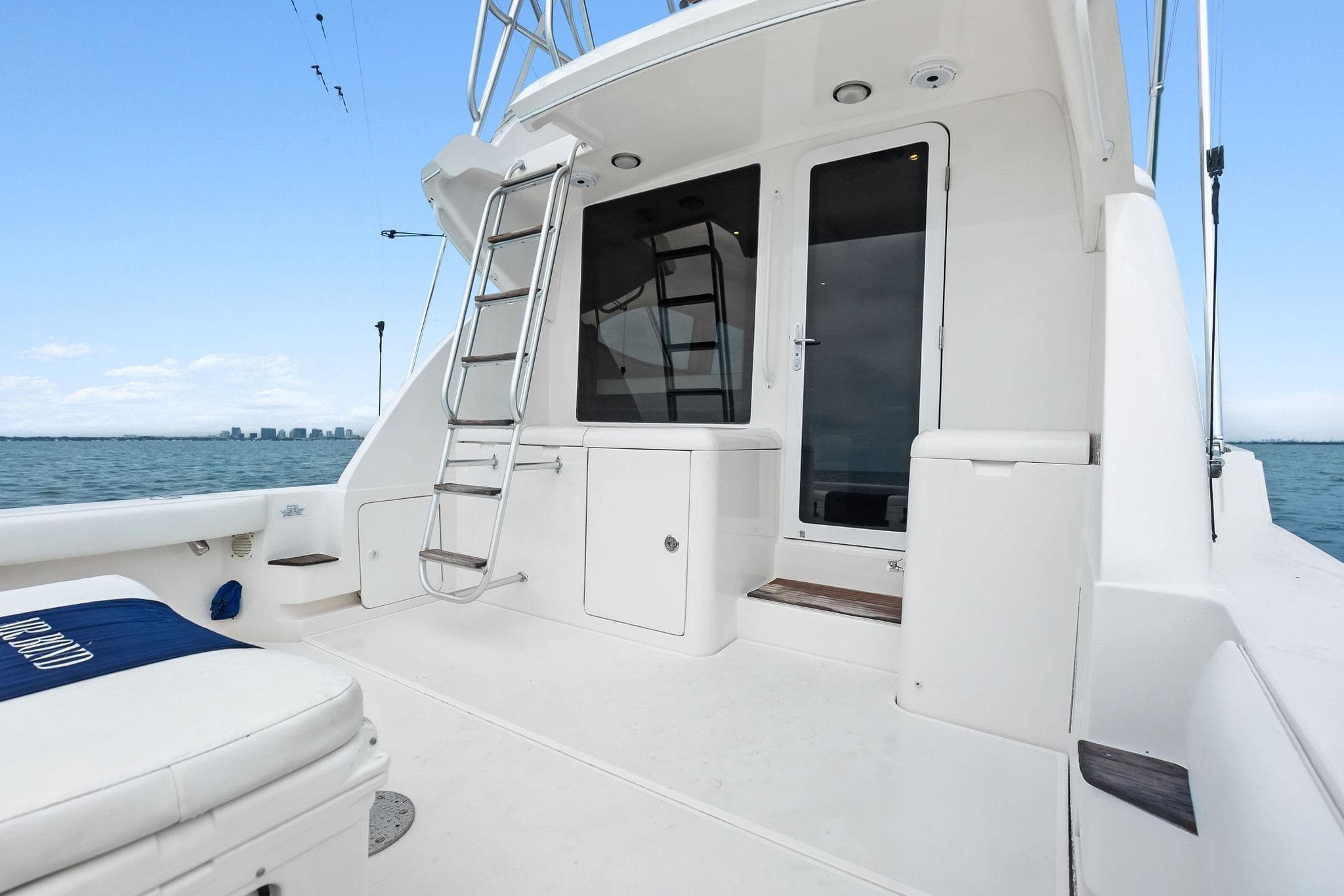 2006 Bertram 39 Convertible yacht deck with ladder and ocean view.