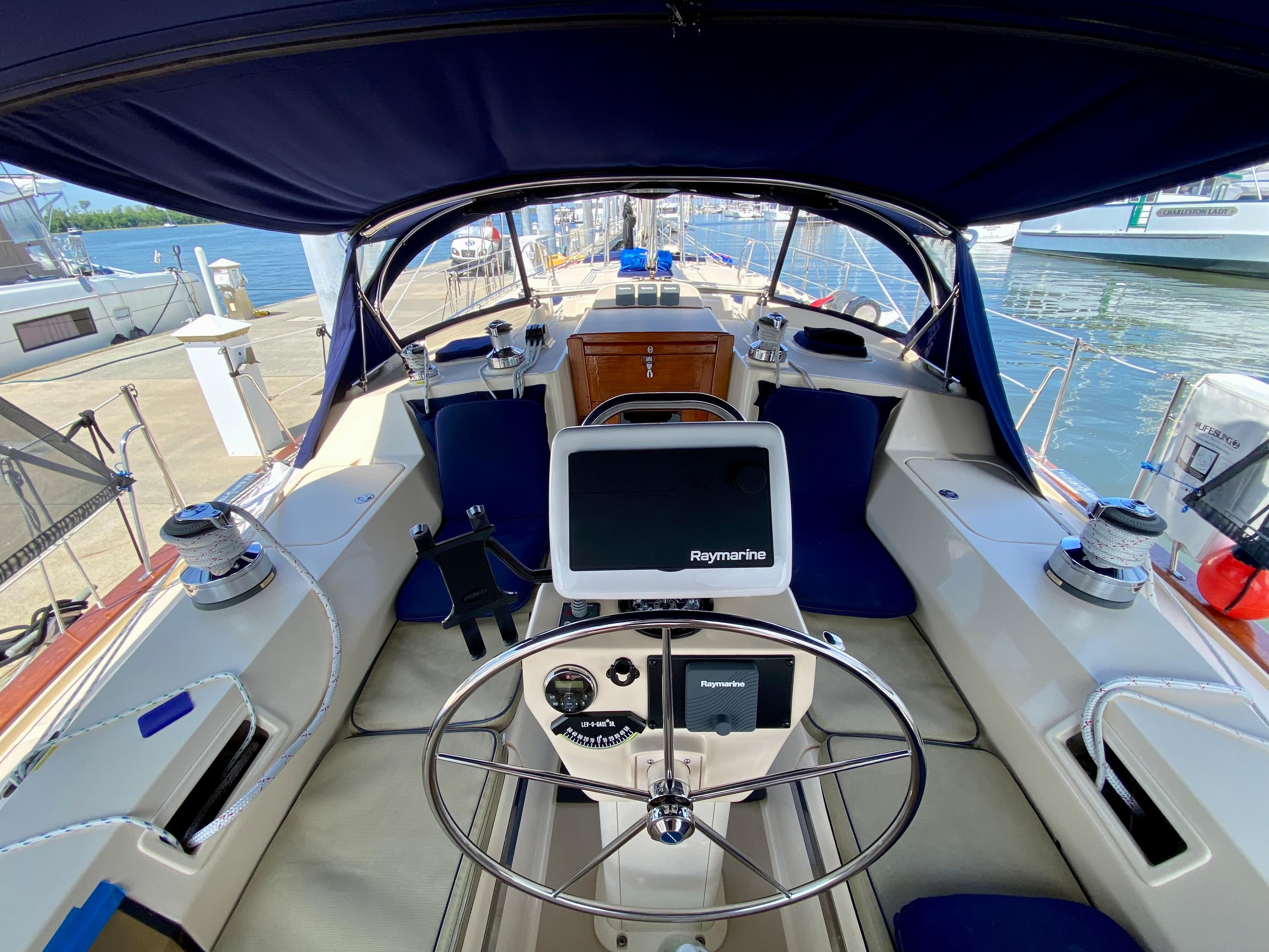 Island Packet 440 sailboat cockpit, 2006 model, featuring steering wheel and navigation system.
