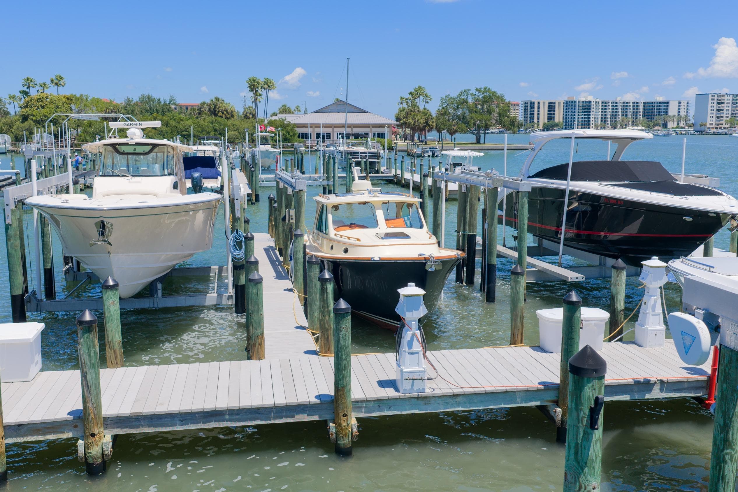 Hinckley Picnic Boat 34 MKII 2020 docked among other boats at a marina.