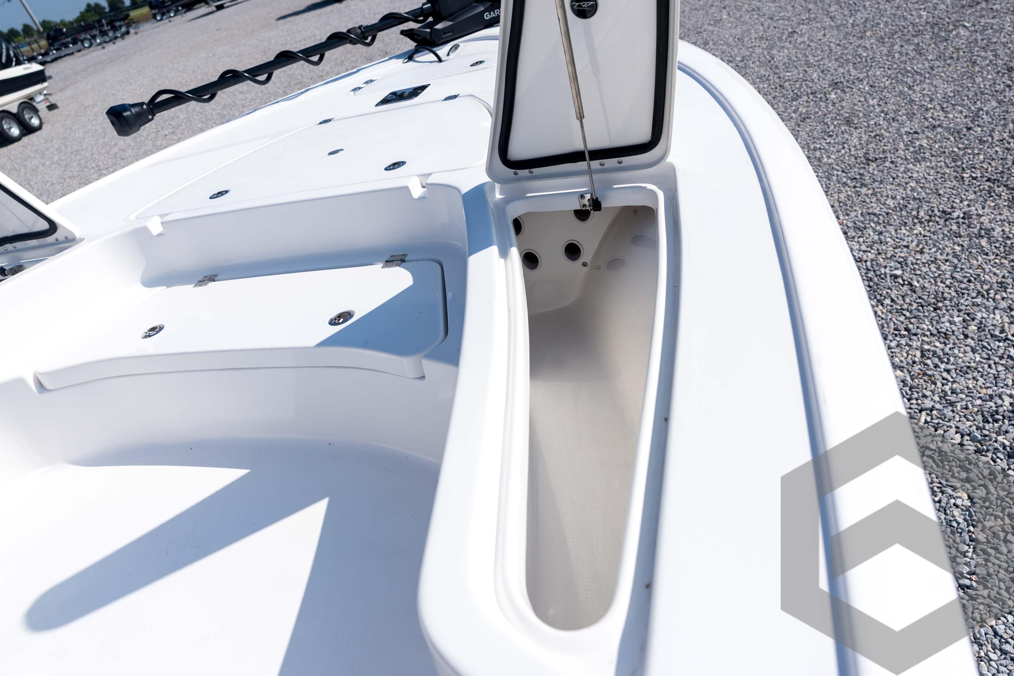 2026 Tidewater 2410 Bay Max boat with open storage compartment on deck.