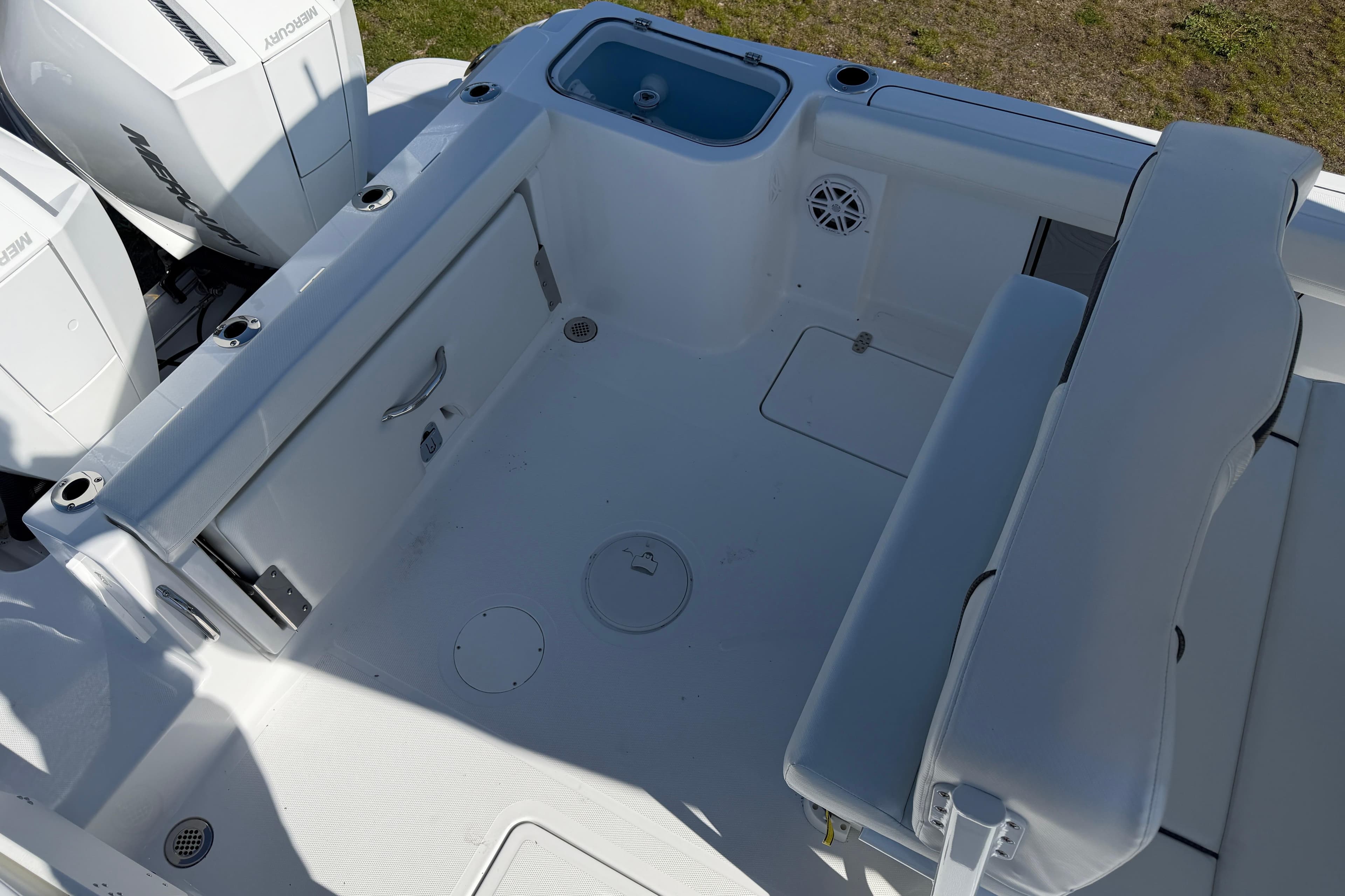 2026 Wellcraft 243 Fisherman boat interior with seating and storage compartments.