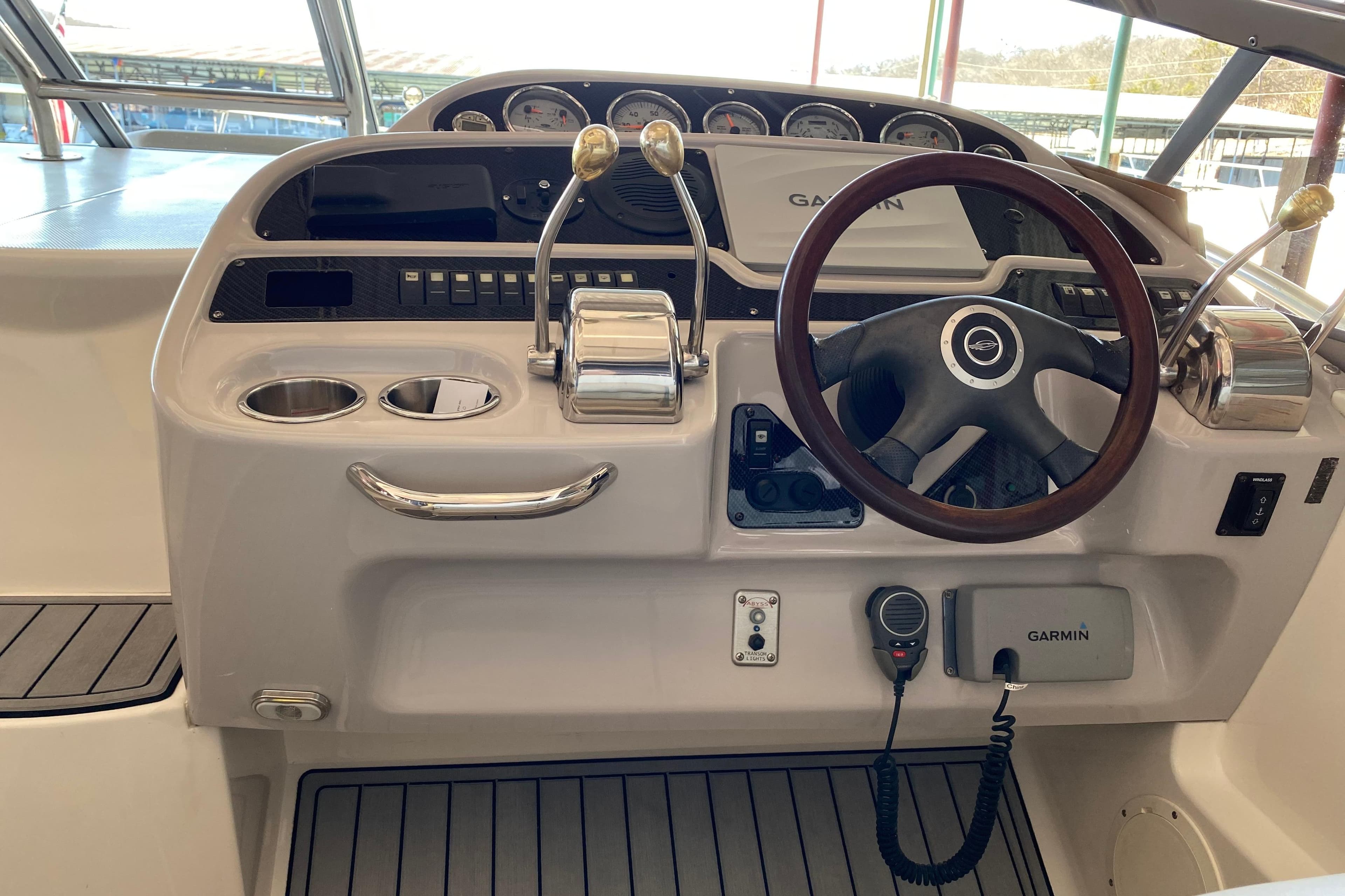 Cockpit of 2007 Chaparral 350 Signature with Garmin navigation and dual throttle controls.