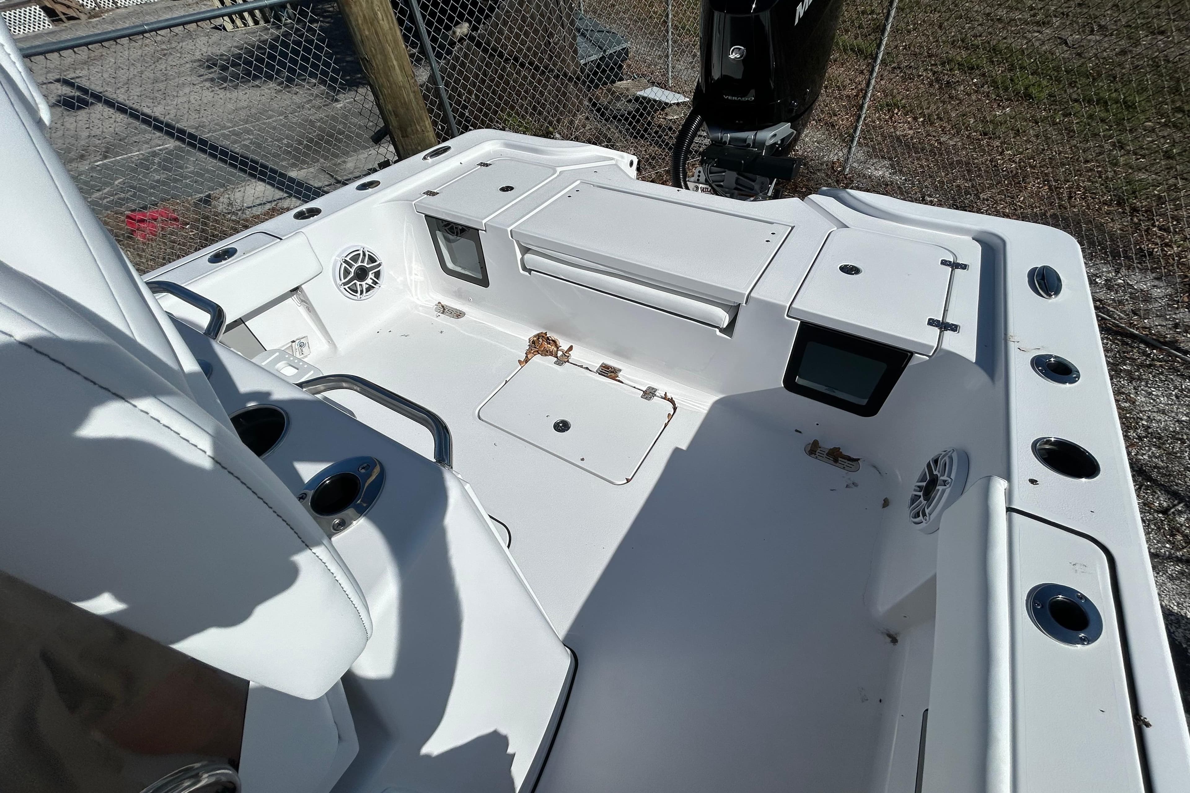 2026 Sportsman Masters 267OE Bay Boat interior with storage compartments and cup holders.