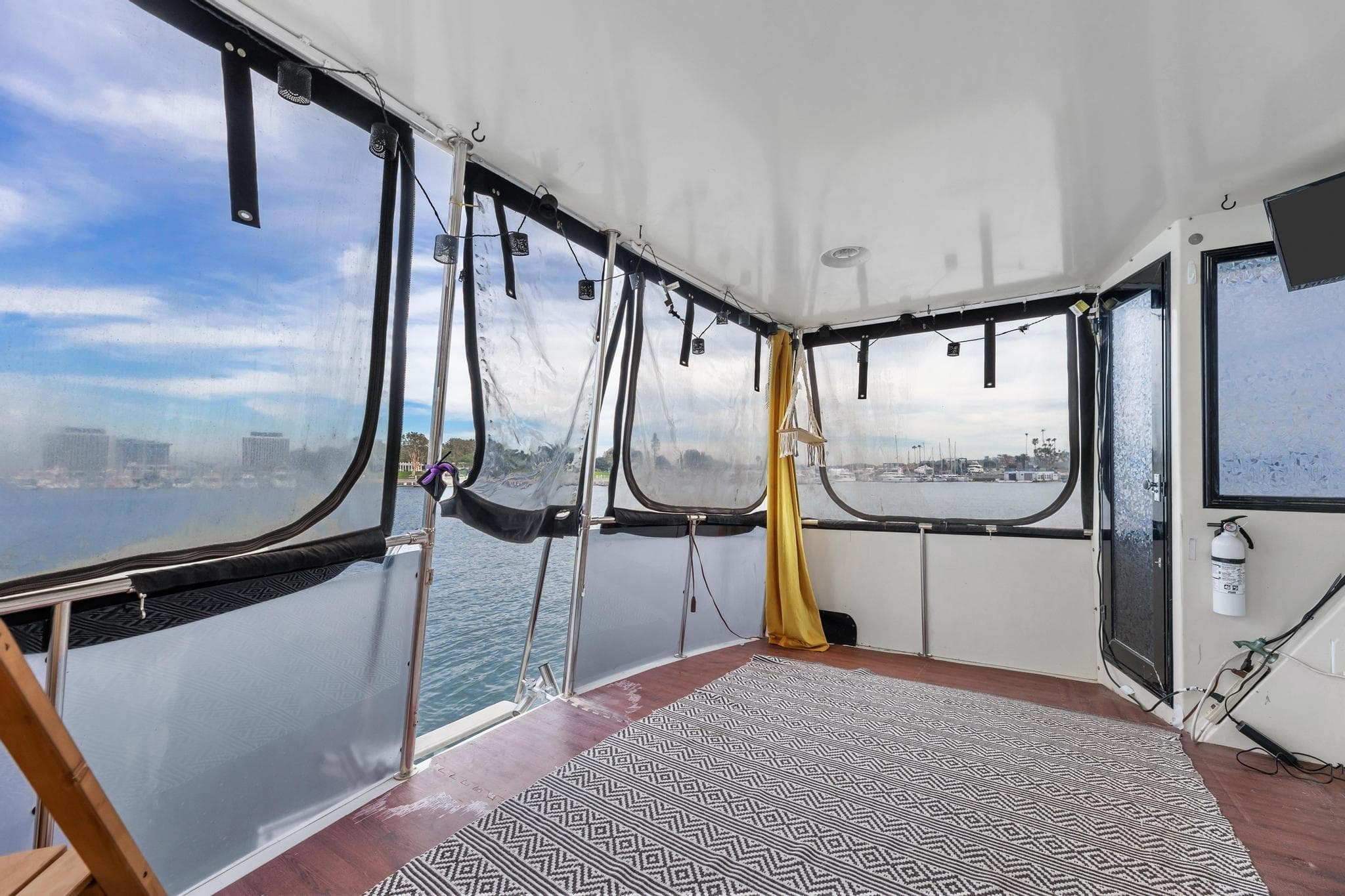 1988 Marine Trader Trawler interior with panoramic windows and nautical decor.