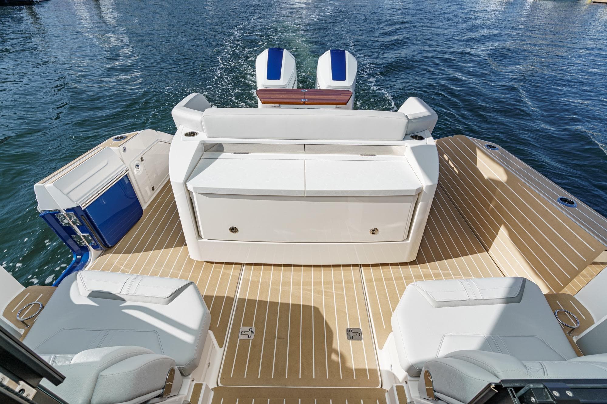 2026 Tiara Yachts 43LE luxury boat deck with seating, on calm water.