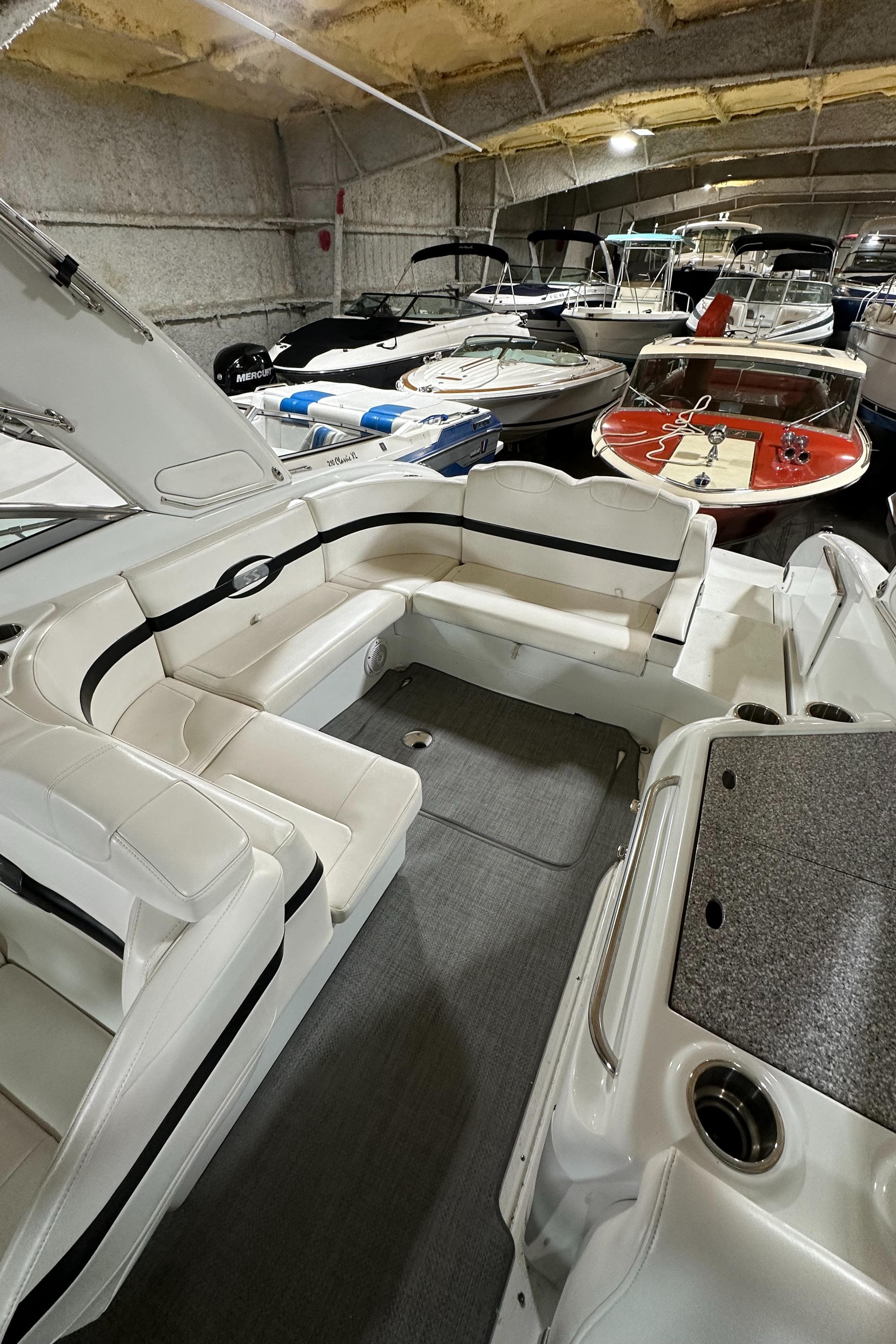 2007 Formula 310 Sun Sport boat interior in storage, featuring white seating and modern design.