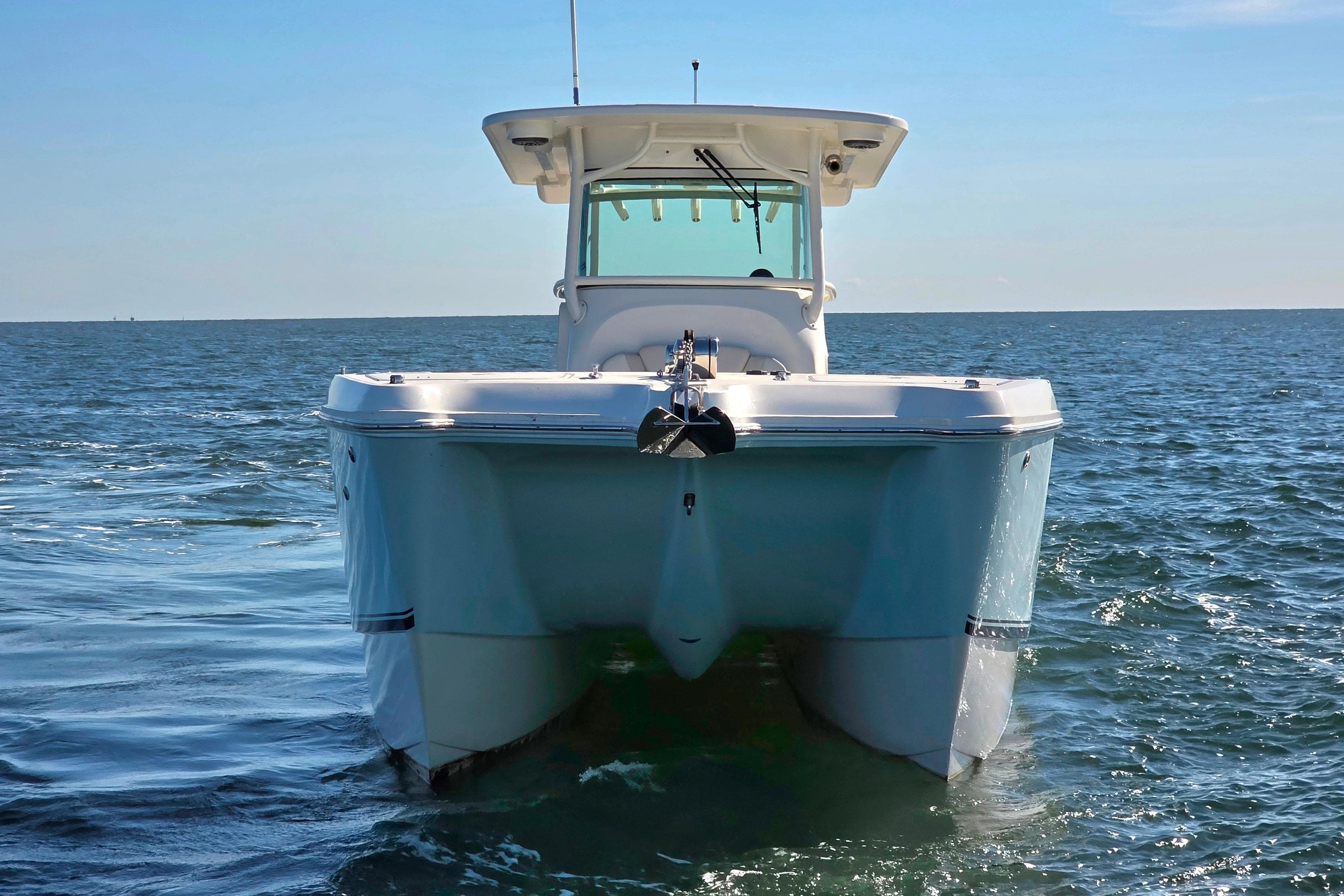 2024 World Cat 325 CC boat on open water, front view.