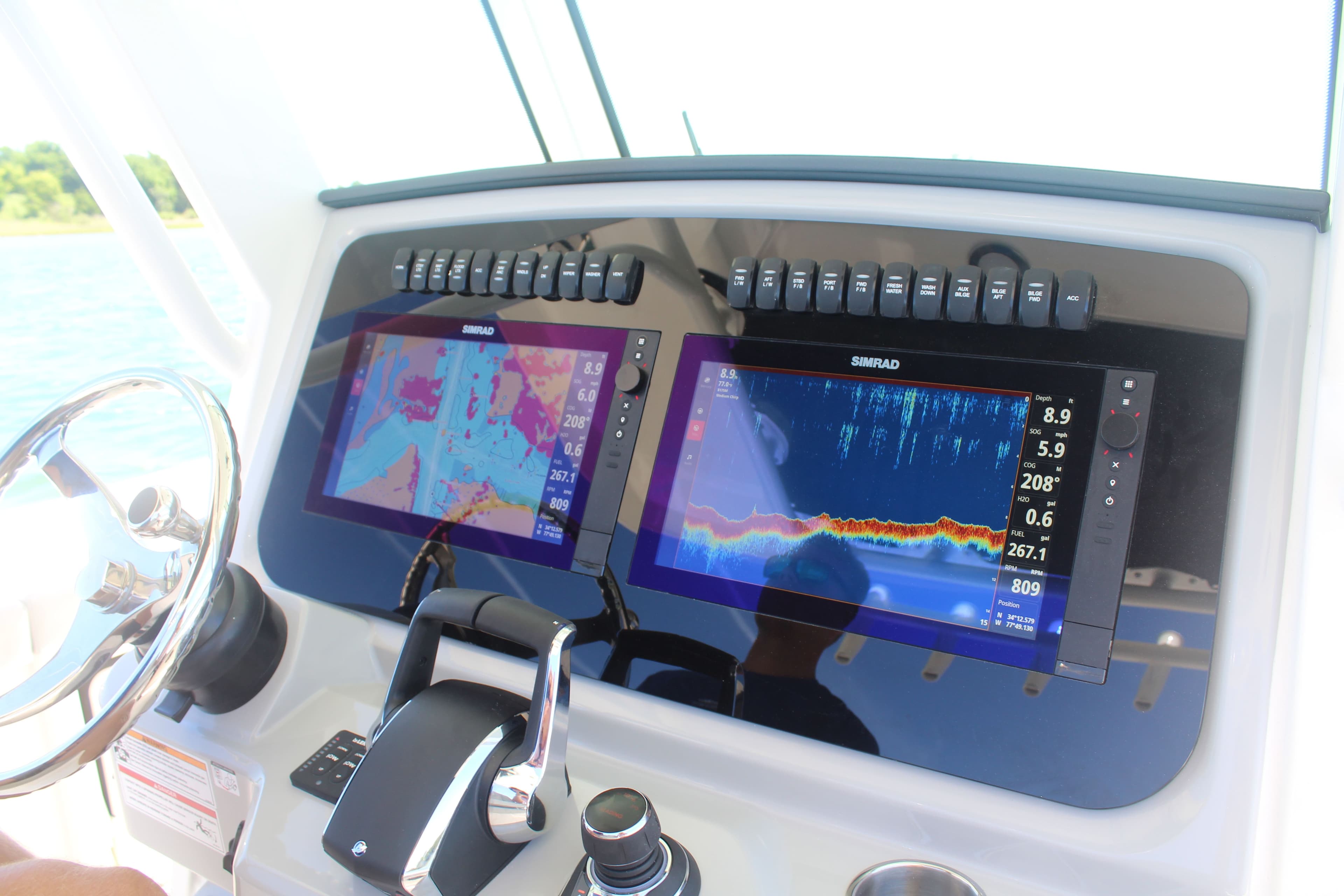Boston Whaler 330 Outrage 2026 navigation system with Simrad displays.