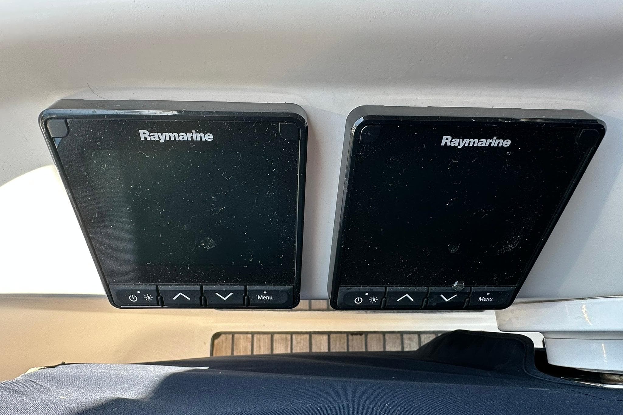 Raymarine navigation displays on a 2000 Beneteau 50 yacht dashboard.