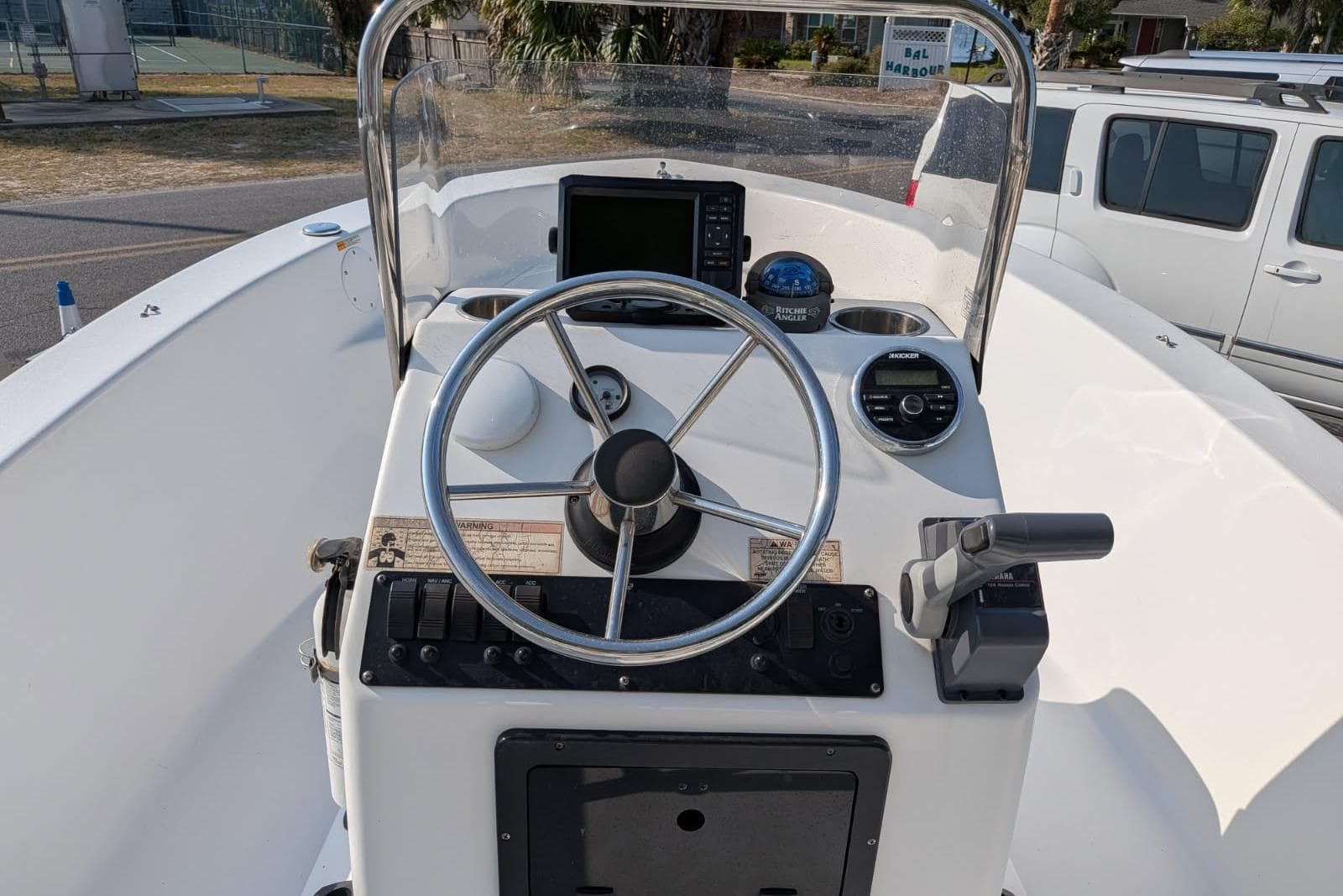 2016 Sportsman Island Reef 17 Center Console boat dashboard with steering wheel and controls.