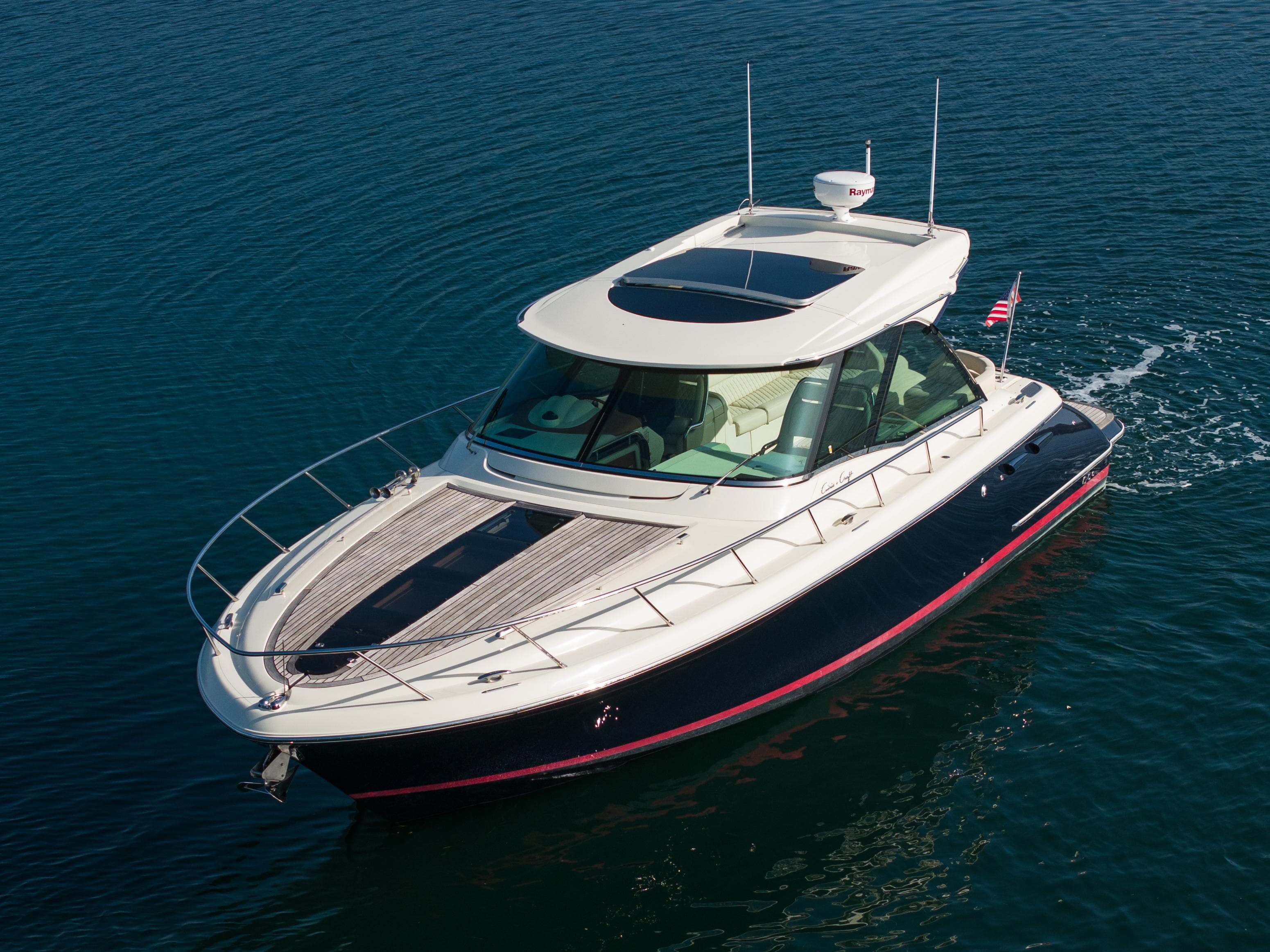 2014 Chris-Craft Corsair 36 Hard Top cruising on calm blue water.