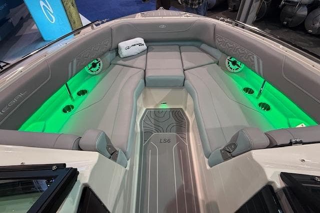 2026 Regal LS6 Surf boat interior with green LED lighting and luxurious seating.